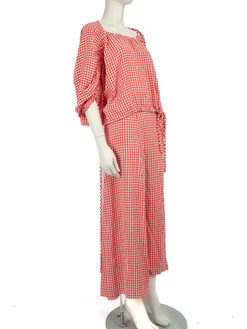 CONDITION is Very good. Minimal wear to the matching set is evident. There is a small mark on the front of the top, in the bust area on this used Scanlan & Theodore designer resale item.
 Details
 Red
 Viscose
 Matching set: Top and Skirt
 Short