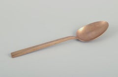 'Scanline' brass flatware by Sigvard Bernadotte. Four-person dinner set.