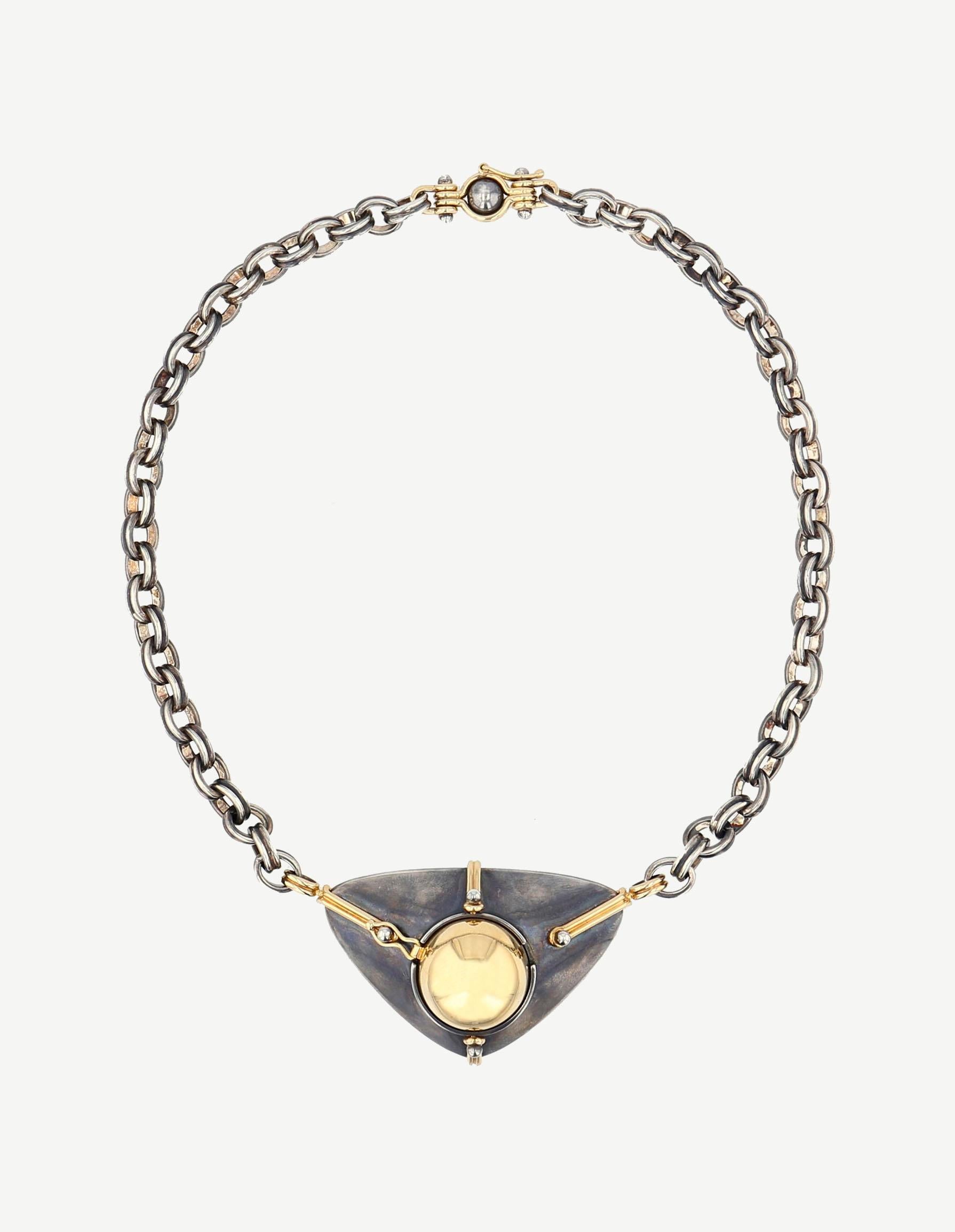 Choker Necklace made from distressed silver and 18K Yellow Gold. Half-sphere opening on an onyx, circled with a white gold satellite and diamond.