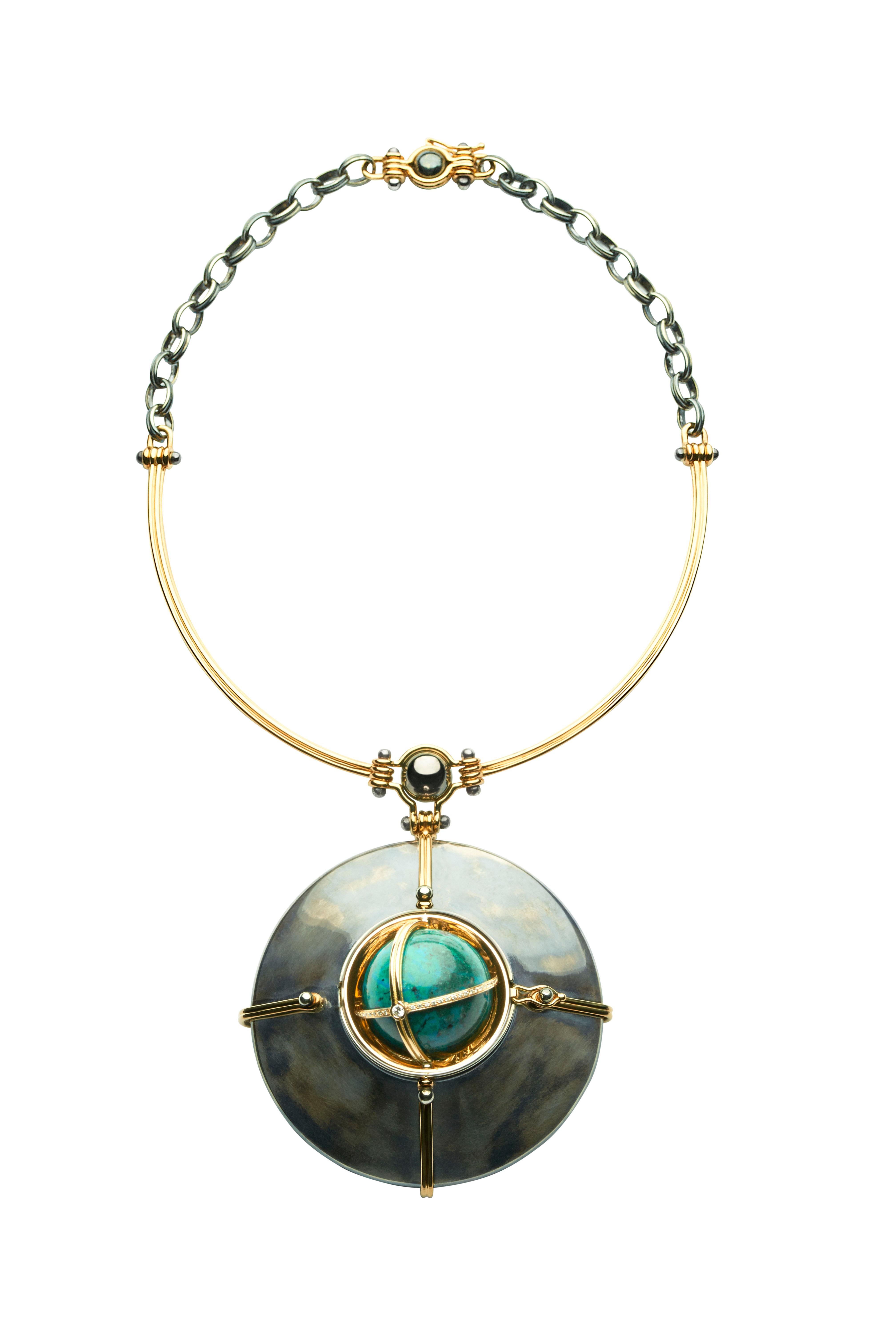 18K Yellow Gold and distressed silver choker pendant  made of an articulated yellow gold strand and a distressed silver chain. The yellow gold sphere is rotating on a distressed silver structure bound by gold links and opening on a Chrysocolle,