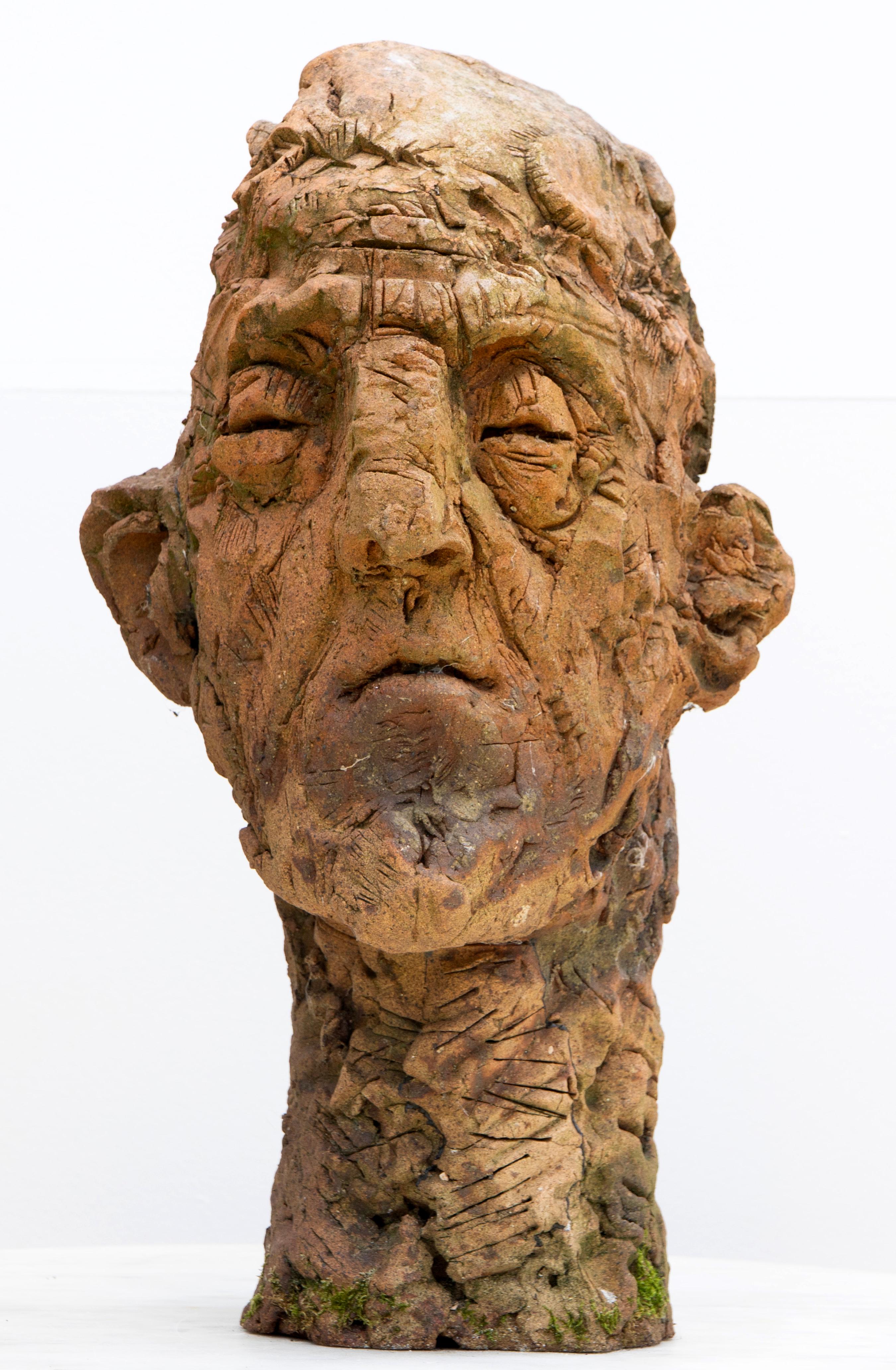 This large ceramic head sculpture, Testa nº 10, is part of the Testas series, a body of expressionist ceramic heads created in refractory stoneware and fired in reduction. The series of ceramic heads explores the human face through raw modeling,
