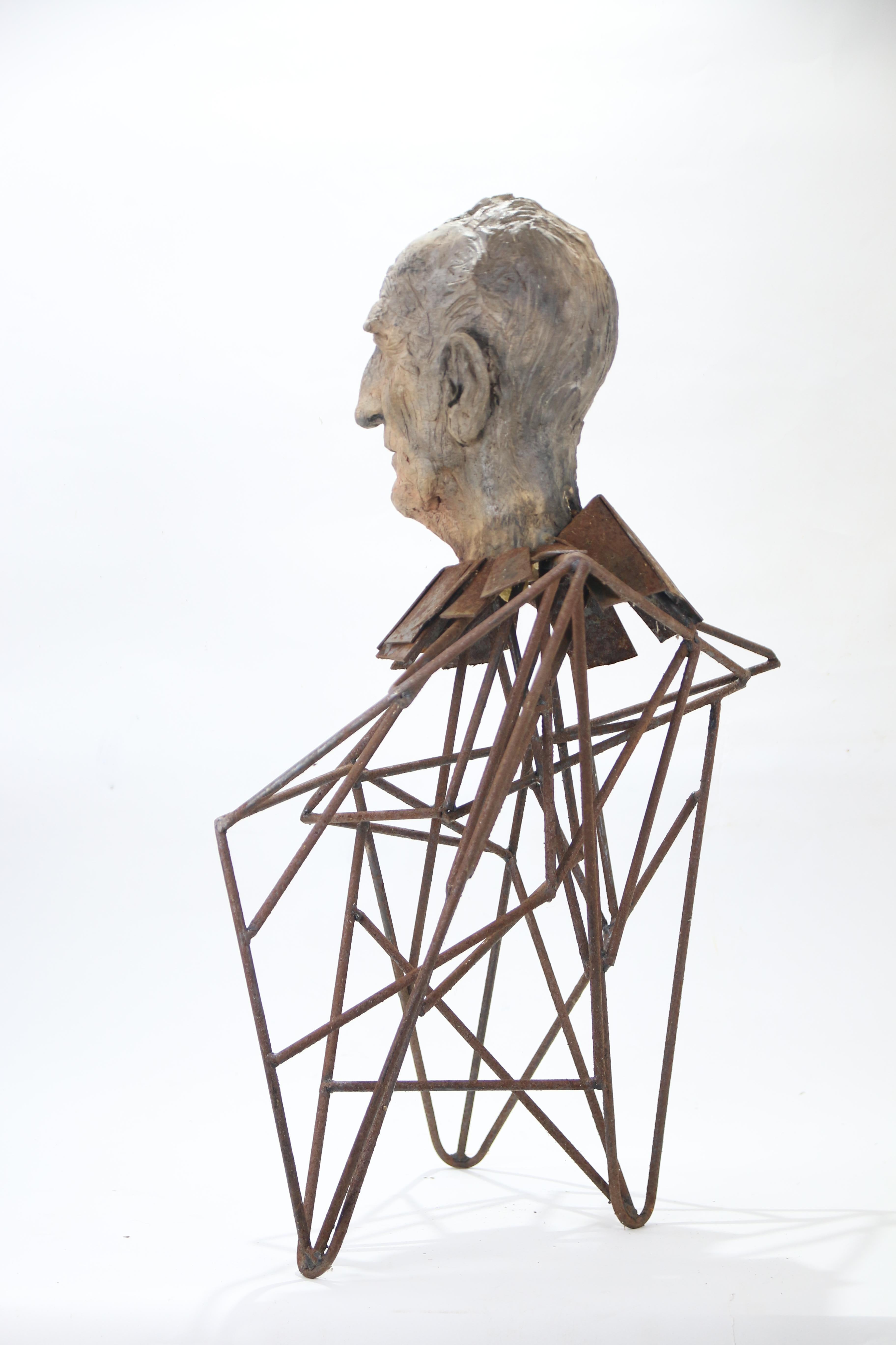 Expressive ceramic bust with forged-iron structure exploring the idea of lifelong learning through a fragile yet resilient human figure. This sculptural bust combines ceramic head and iron body to emphasise emotional tension and the expressive