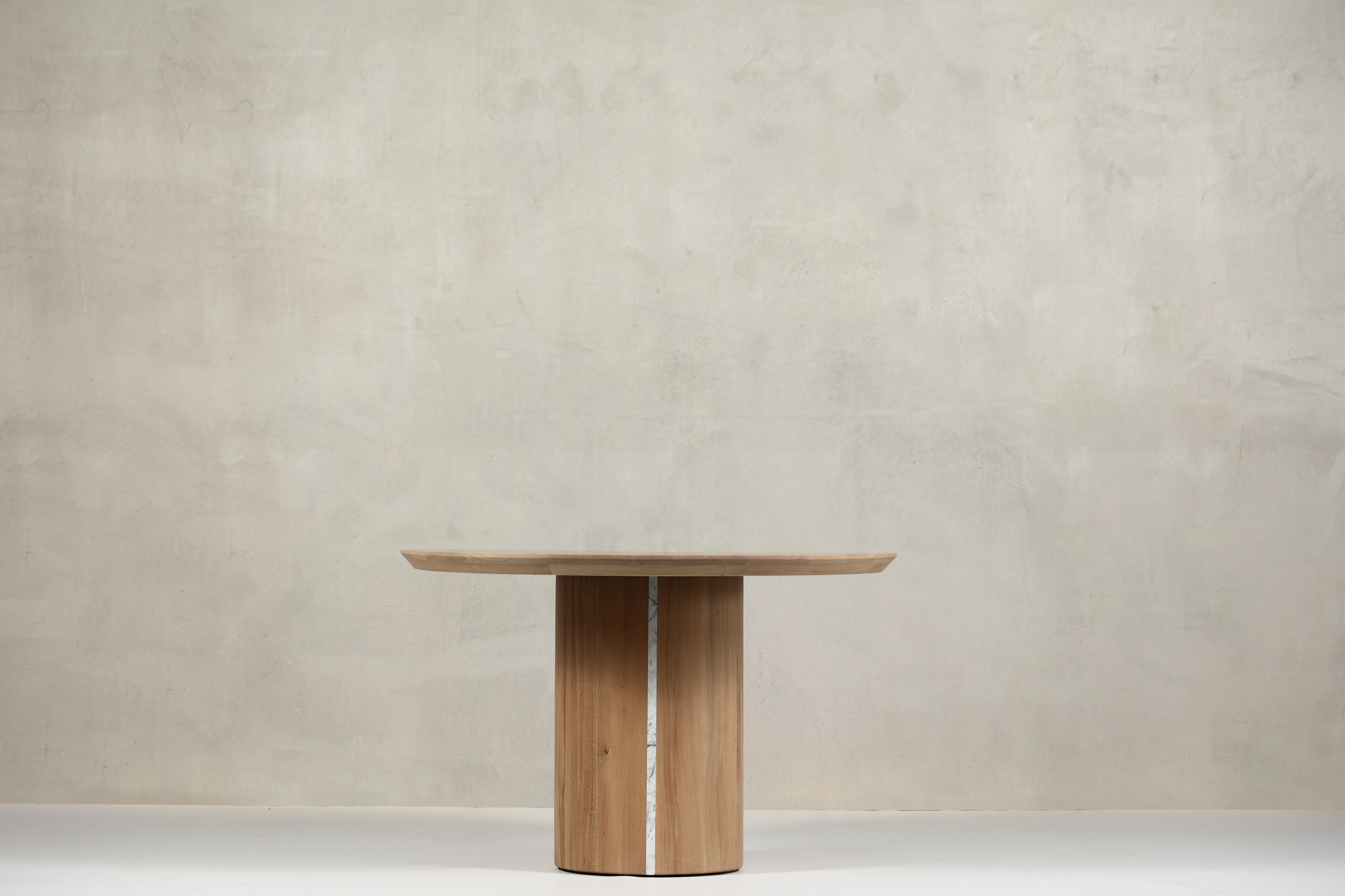 Scar is a dining or meeting table that works in different areas such as HoReCa, Residential or Offices.
 
The leg of the table is the Genesis from which the rest of the collection starts, this massive oak column is divided into 2 marble - a theme