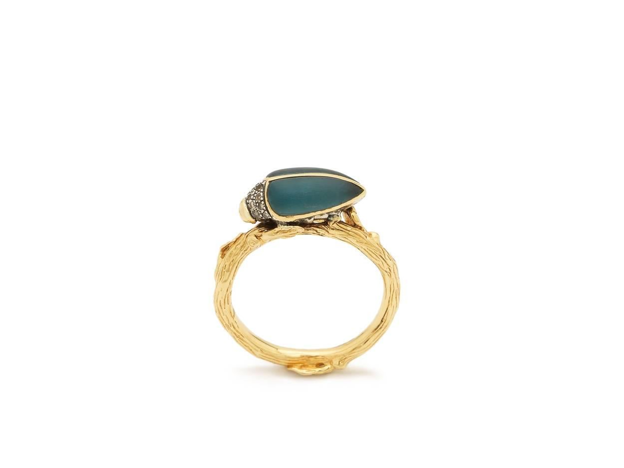 The Blue Topaz Scarab Stackable ring is made of 18k Yellow Gold, Sterling Silver, Brown Diamonds, and hand-carved deep Blue Topaz. This ring is from Bibi van der Velden's iconic Scarab Collection, and is perfect for stacking with her other stackable