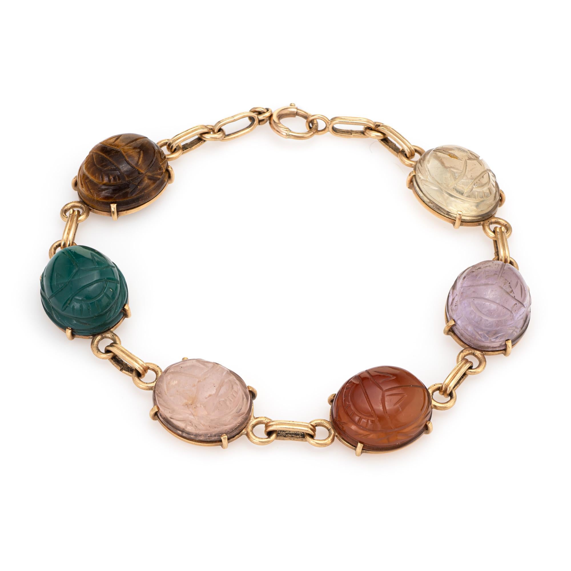 Stylish and finely detailed vintage scarab bracelet (circa 1960s to 1970s) crafted in 14 karat yellow gold. 

The stones (amethyst, white quartz, rose quartz, carnelian & jasper) each measure 13.5mm x 12mm. The stones are in excellent condition and