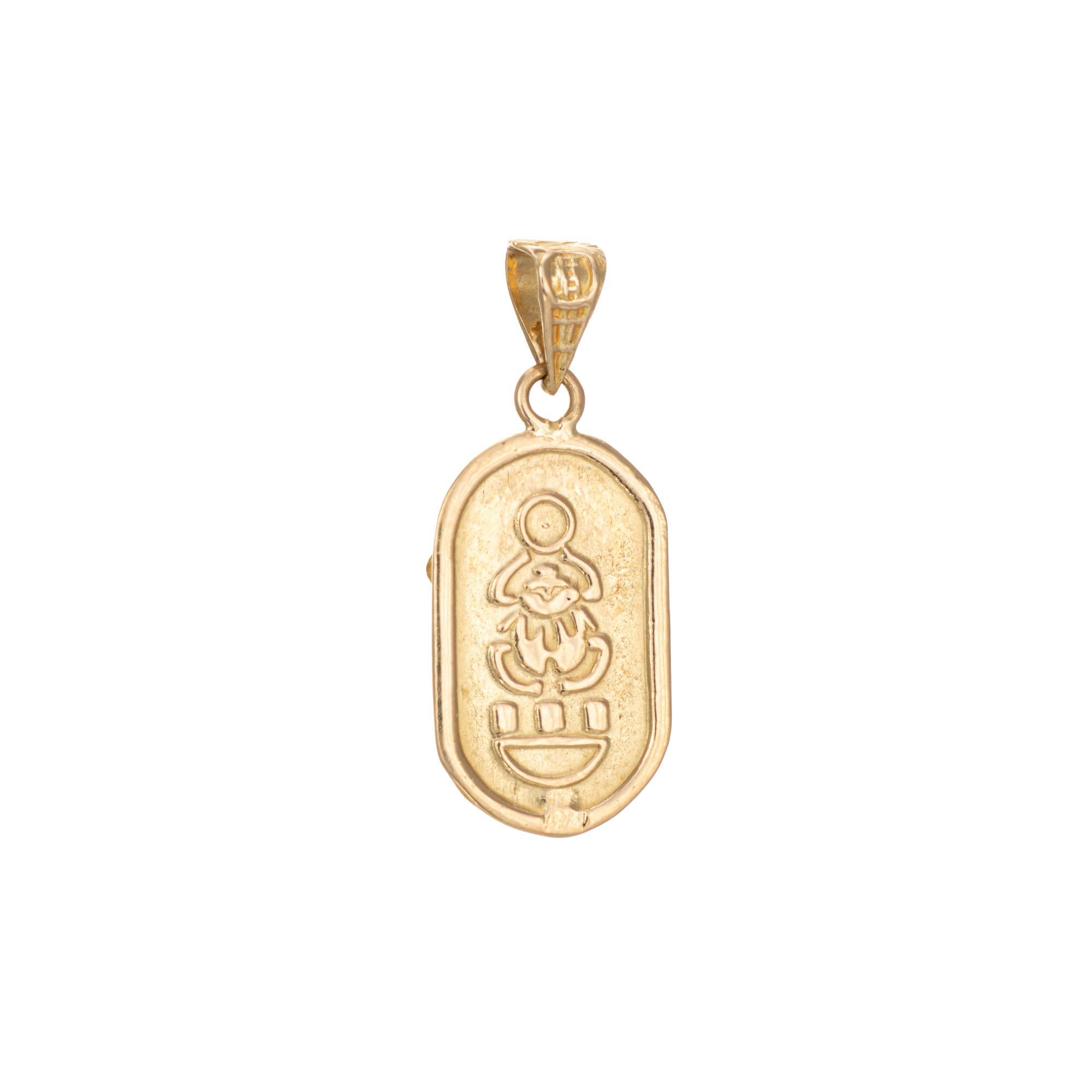 Finely detailed vintage Scarab beetle charm crafted in 18k yellow gold.  

Lapis lazuli is set into the mount, measuring 6mm x 4mm.

The nicely detailed scarab is rendered in lifelike detail with embossed hieroglyphs to the reverse side. The scarab