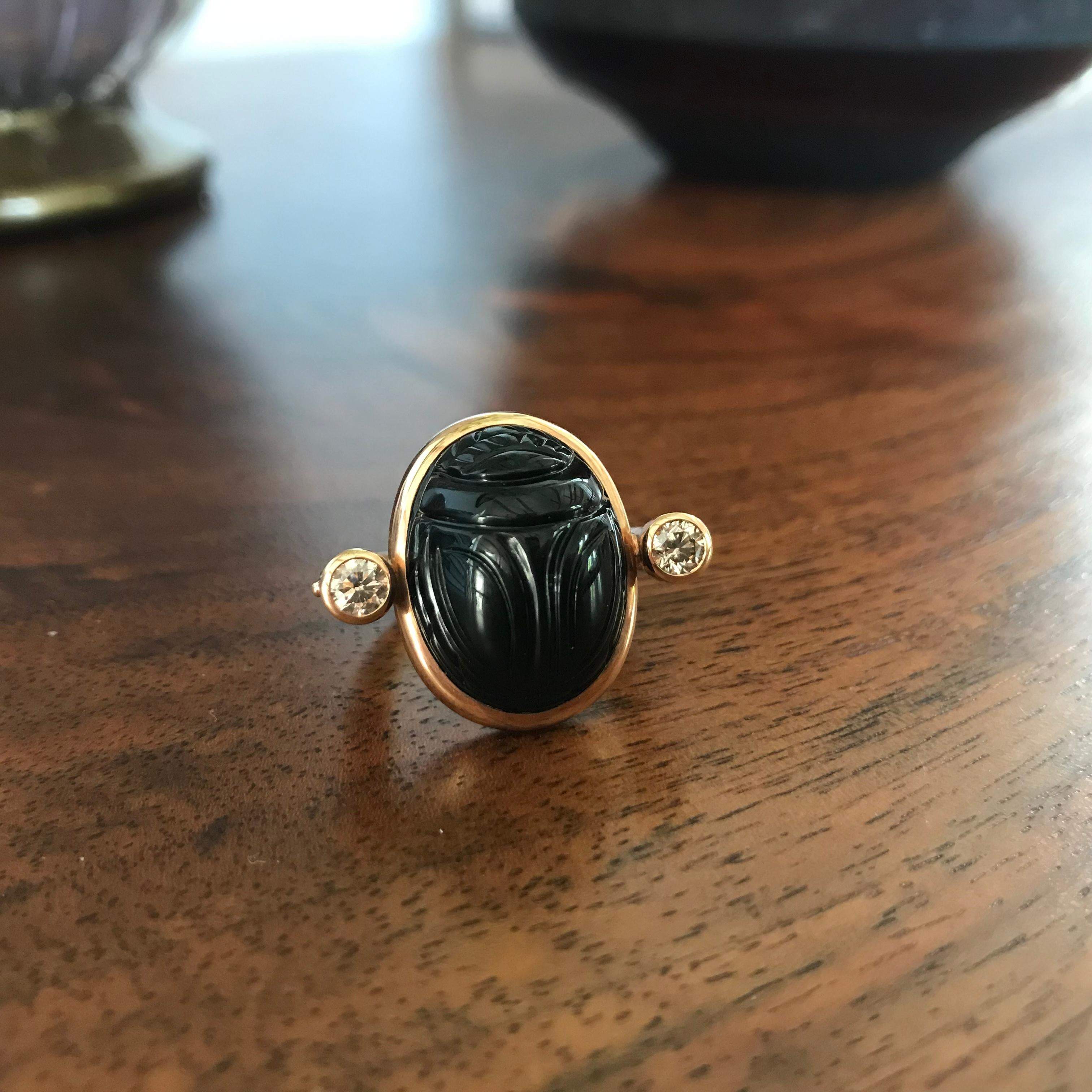 Egyptian Revival Scarab ring in 18 carat rose gold, 1 onyx 20.35 ct, 2 cognac diamonds 0.49 ct
