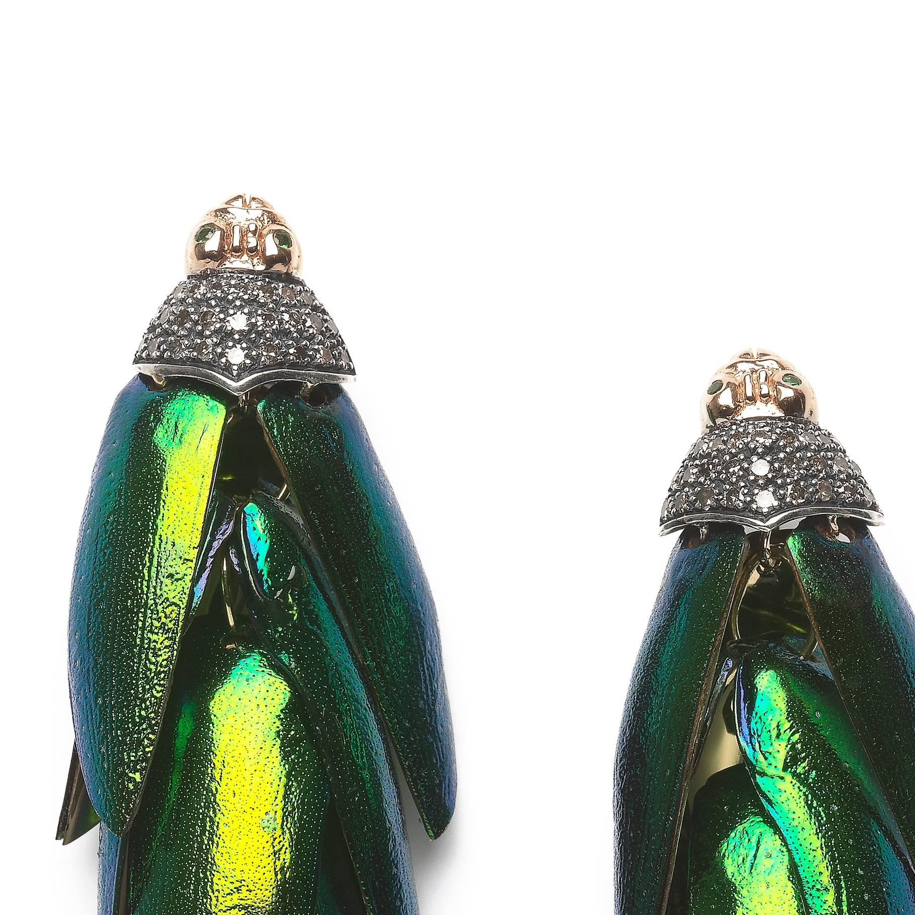Around 40 real scarab wings are individually set on these drop earrings, and gently move with the wearer as they sit on the lobe. The earrings are designed in 18k yellow gold and sterling silver, with the scarabs’ heads at the posts embellished with