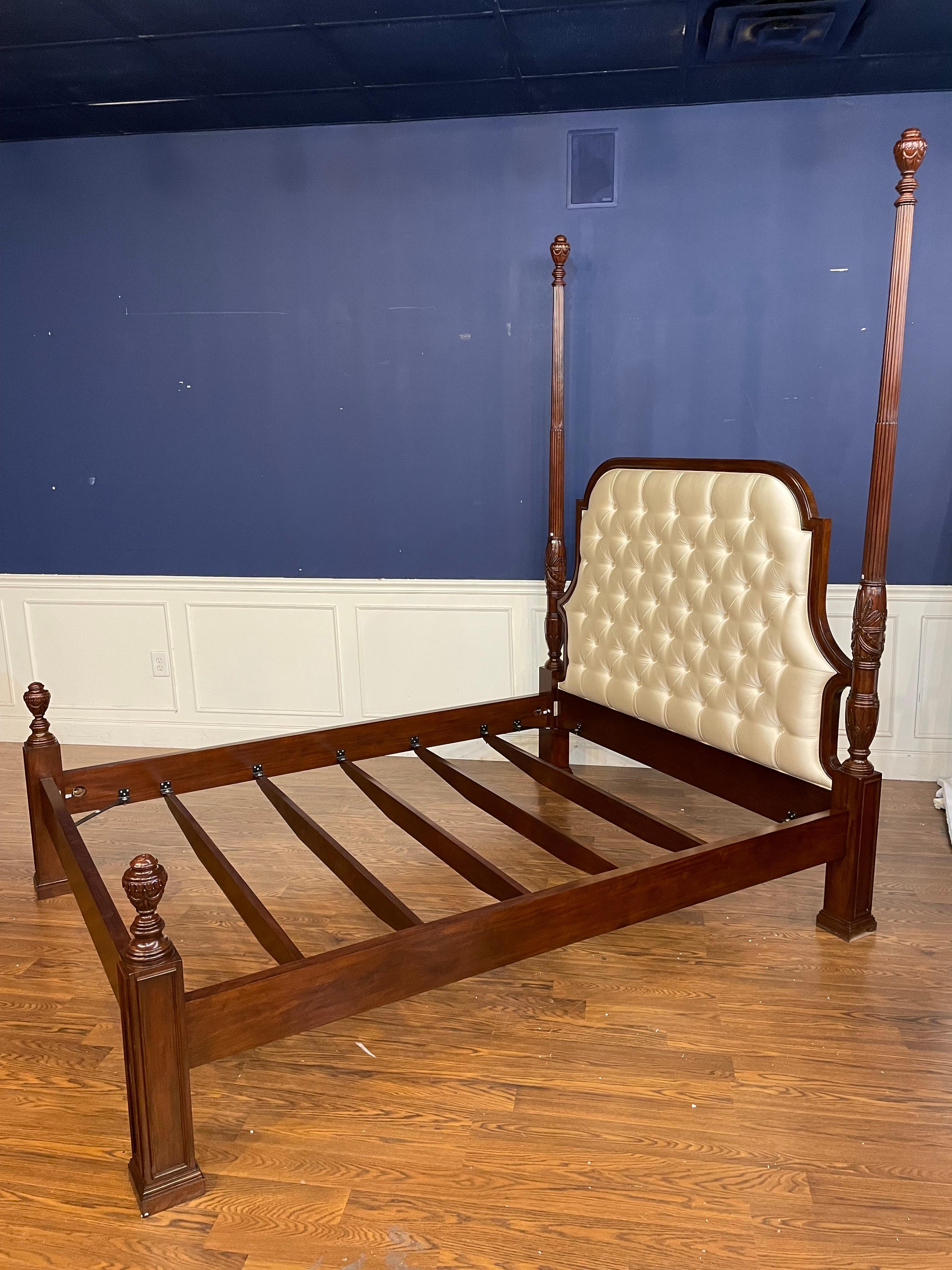 This is a queen size tufted upholstered mahogany poster bed by Scarborough House.  It has been used as a showroom sample for 1-2 years and is in very good condition with only very minor imperfections that you would expect from a showroom sample.  It