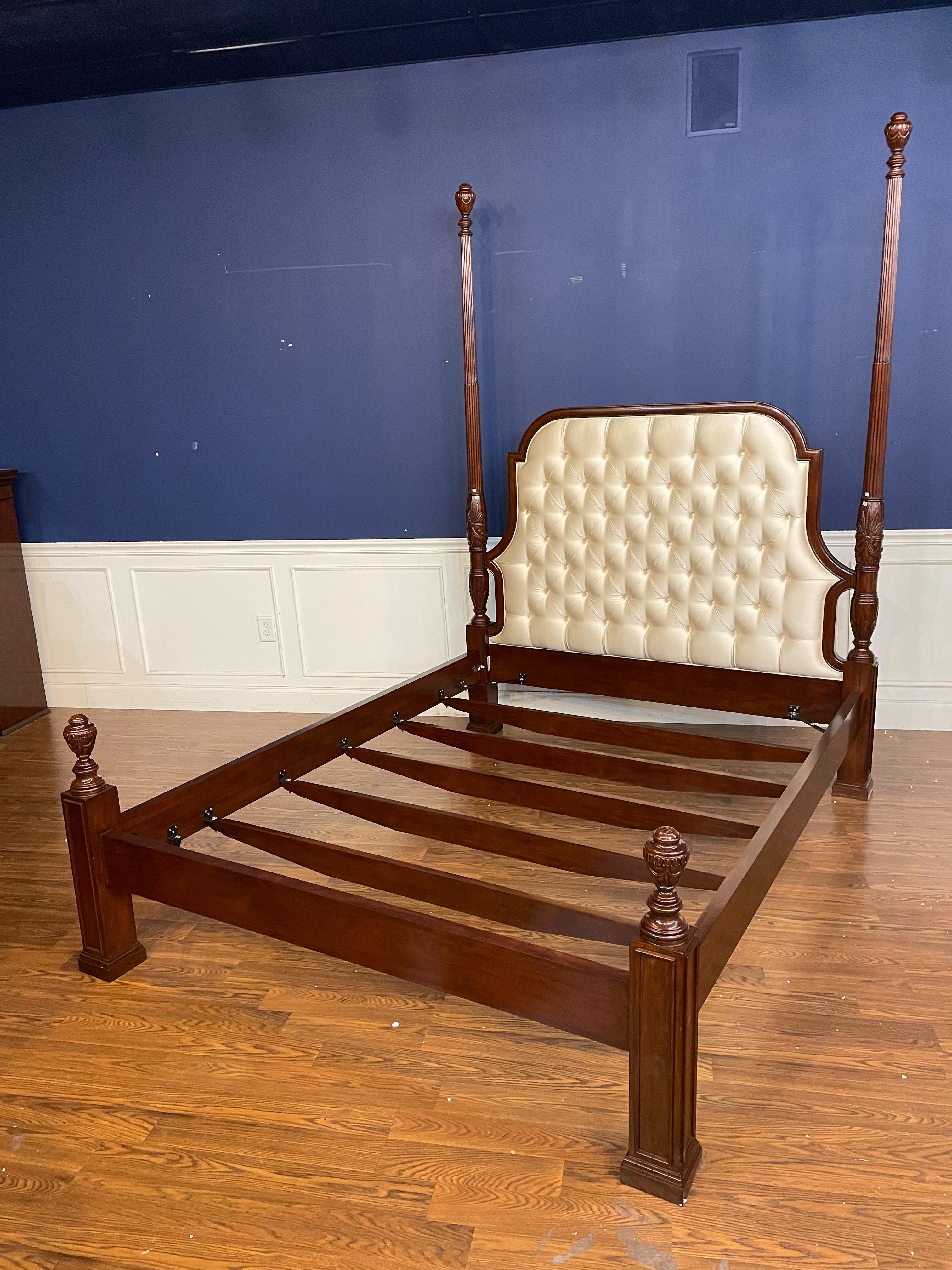 This is a queen size tufted upholstered mahogany poster bed by Scarborough House.  It has been used as a showroom sample for 1-2 years and is in very good condition with only very minor imperfections that you would expect from a showroom sample.  It