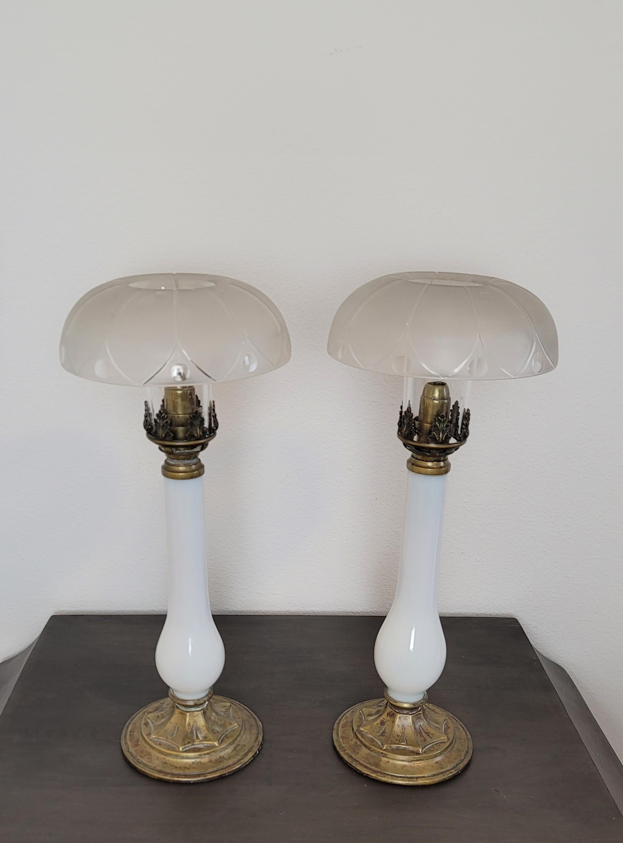 Elegant sophistication at its finest, we present this exceptionally rare pair of early 19th century fine quality French Empire Period candlestick lamps.

The original antique table lamps complete, with clear and frosted glass lotus hurricane shades,