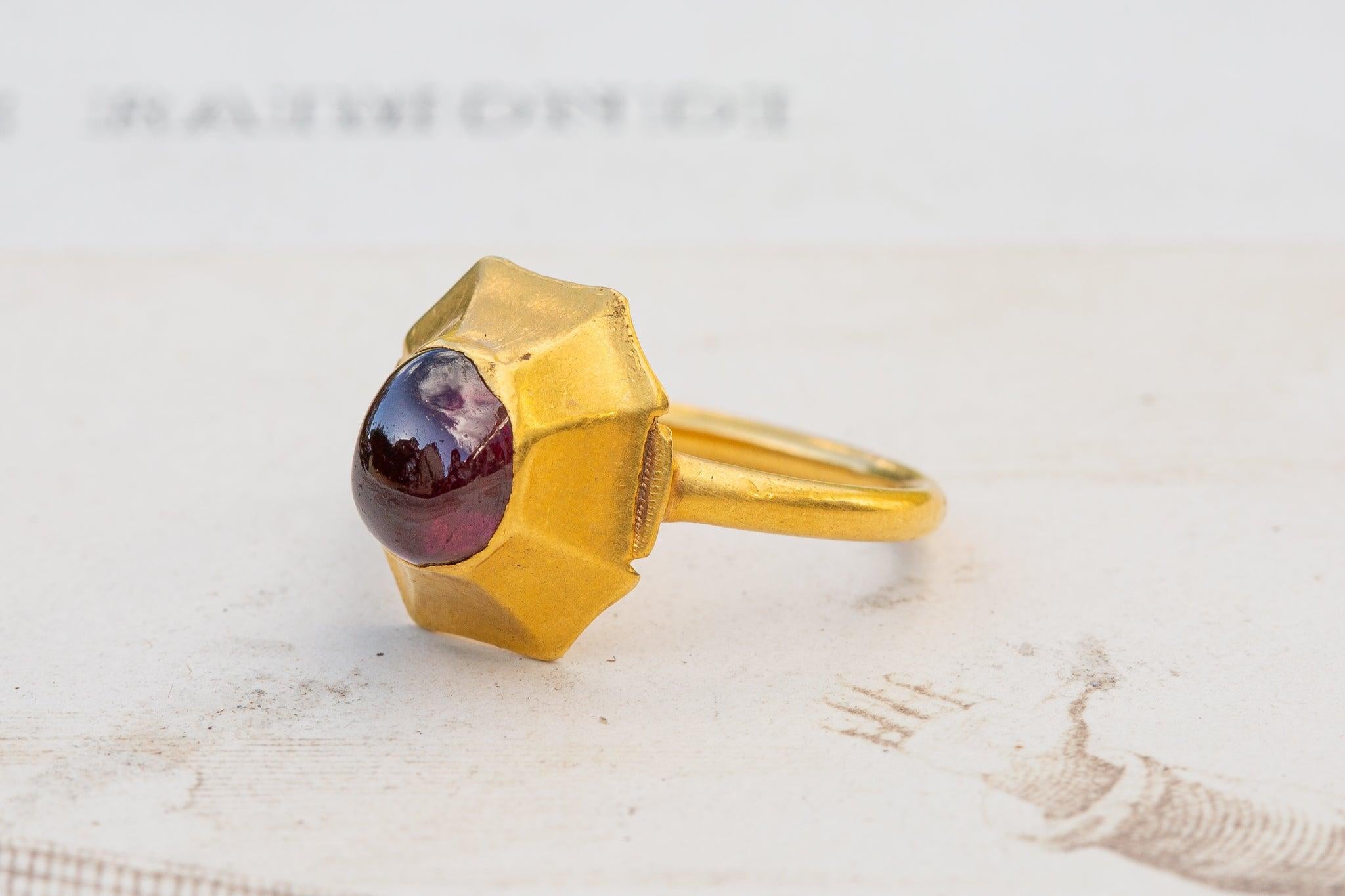 An exceptionally rare late 13th century Medieval period gold ring, made either France or England, circa 1280!

This Medieval high-karat gold ring is set with a large 11ct irregular-shaped garnet cabochon. The 13th century ring-type is what Victorian