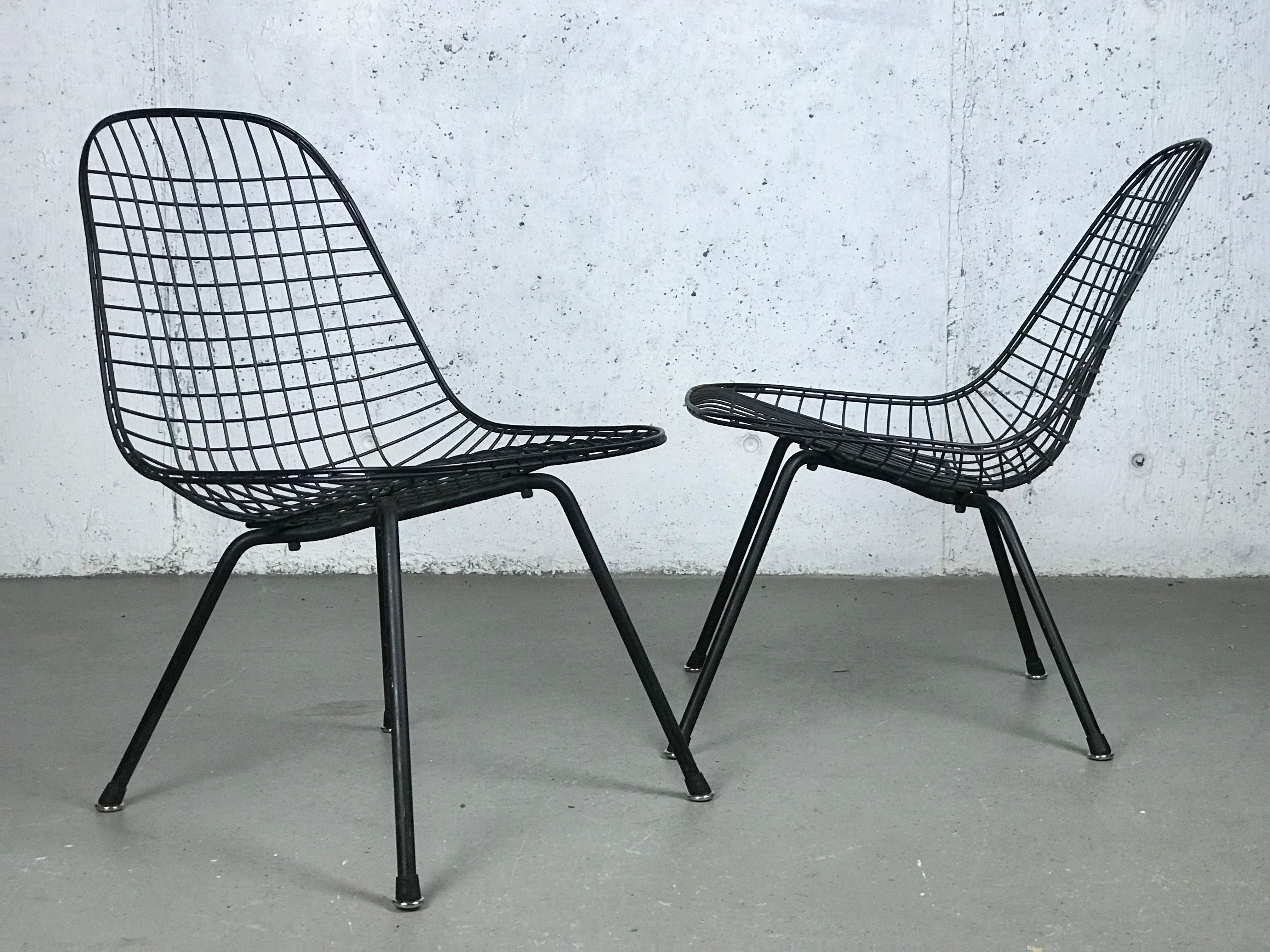Hard-to-find First Generation Eames LKX (Low/Wire/X-base) lounge chairs, only made one year with this configuration; 1951. Made by Charles & Ray Eames for Herman Miller. 
Various areas of wear/oxidation, please see pictures. One chair has a small