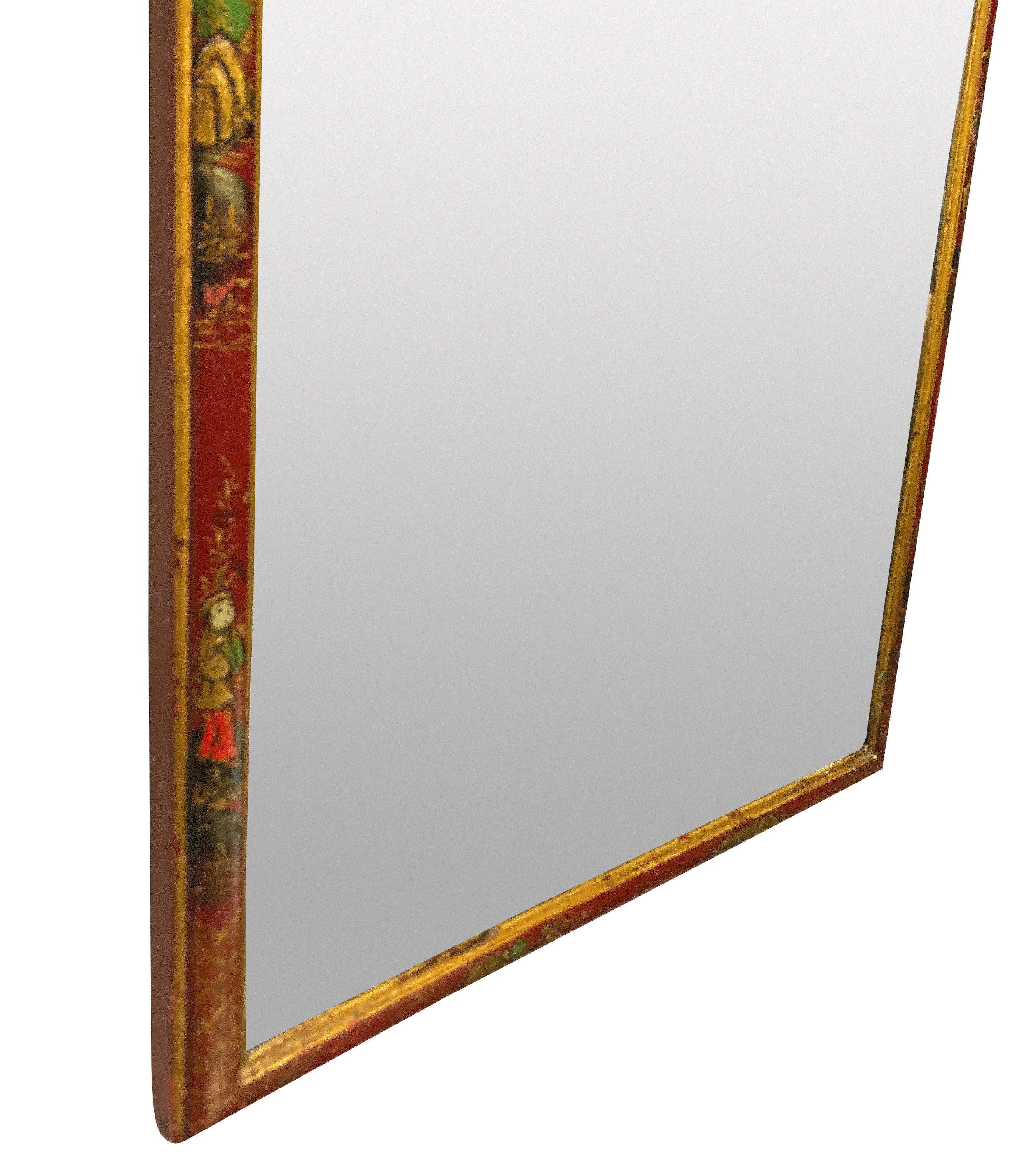 An English scarlet japanned Queen Anne style mirror, with hand painted scenes. There are two vertical scratches to the mirror plate.