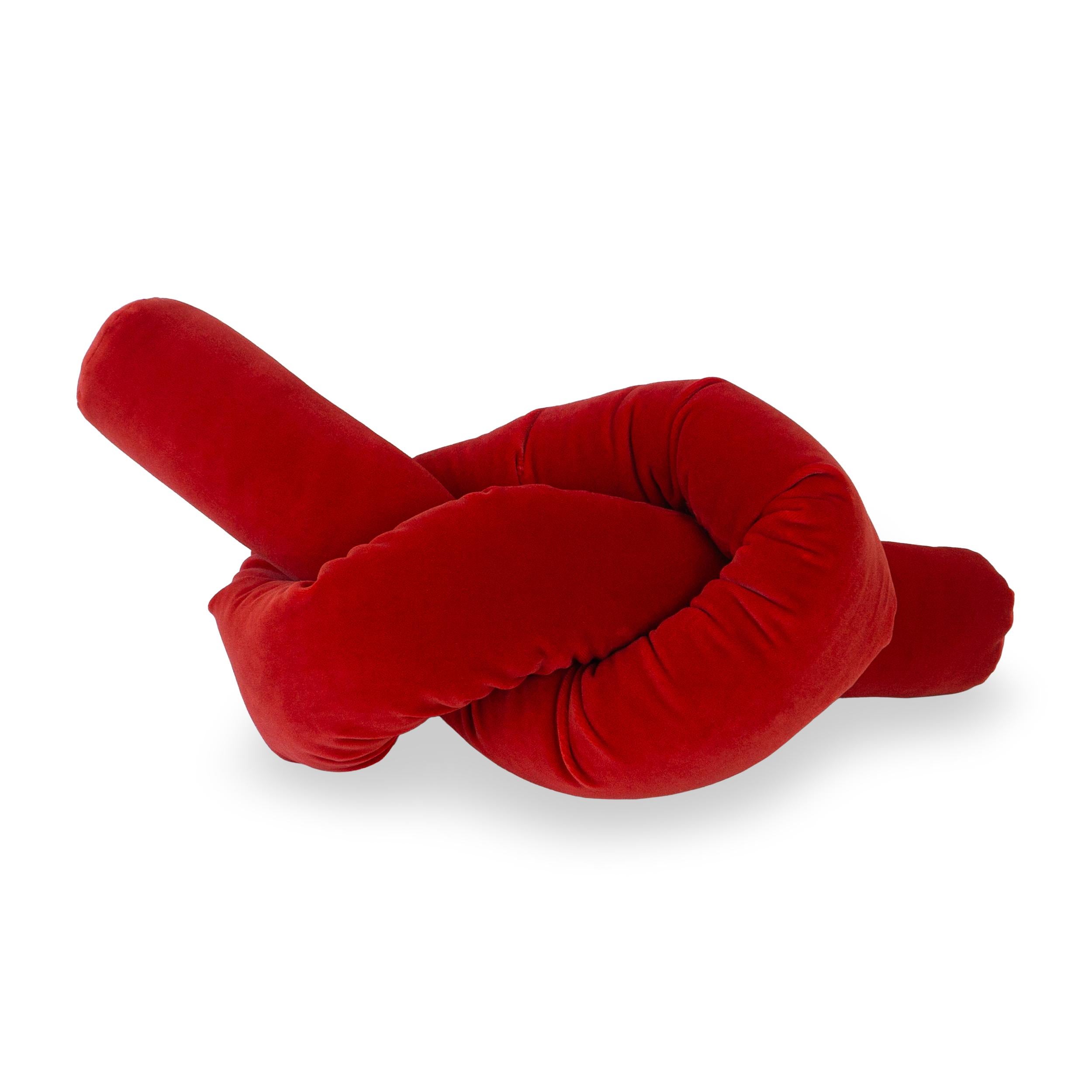 Bold and fun, the Scarlet Red Pretzel Knot Pillow is a modern decorative accent to any living space. Crafted from plush velvet, this modern knot cushion boasts a vibrant red hue and a distinctive pretzel shape, adding a tubular twist to your decor.
