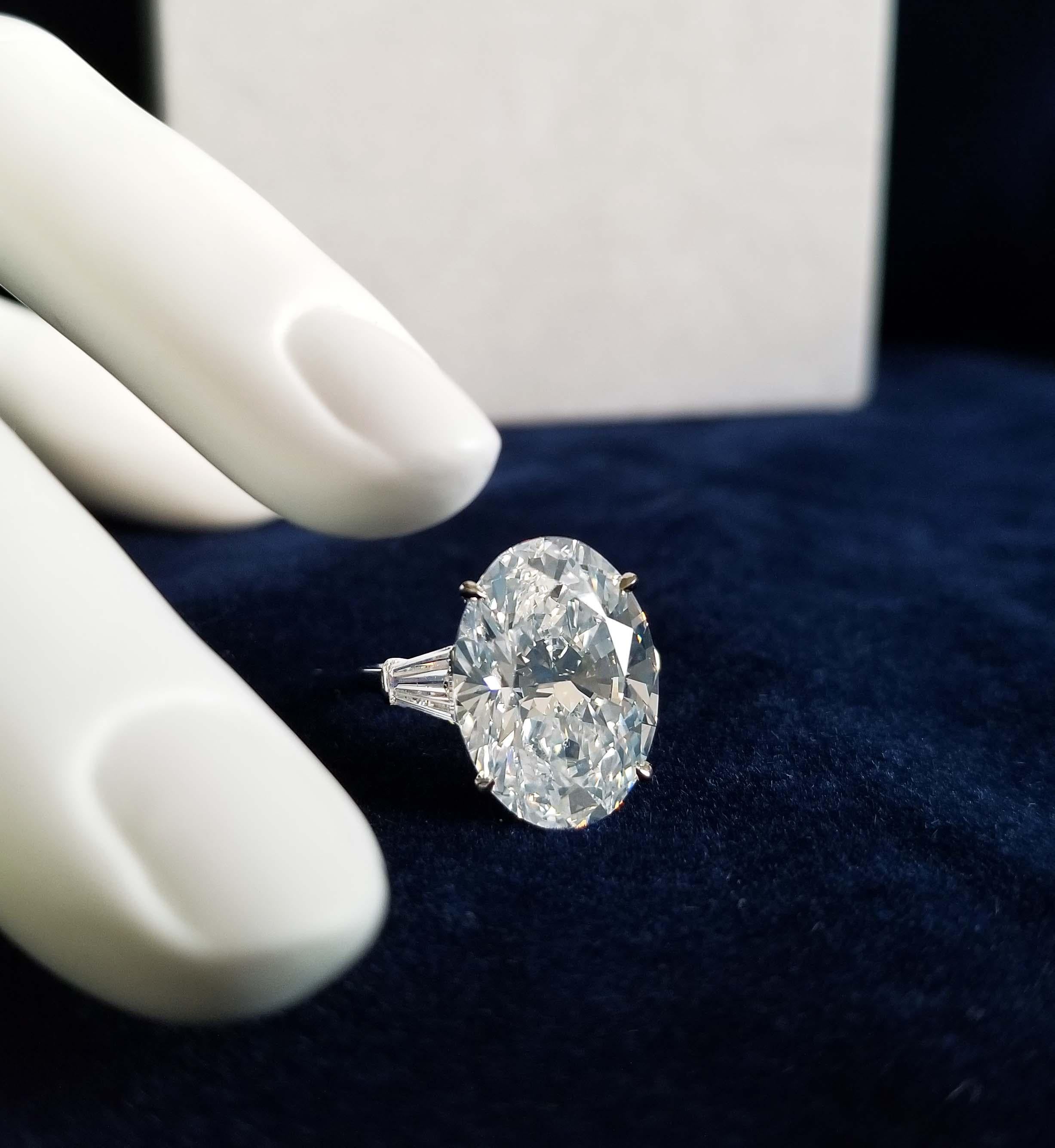 This 11 carat Oval Cut Diamond has been set in a Classic Platinum Solitaire Ring enhancing the beauty of the Scarselli's Diamond (see GIA certificate picture for detailed stone information). The ring sets the diamond beautifully with a pair of side