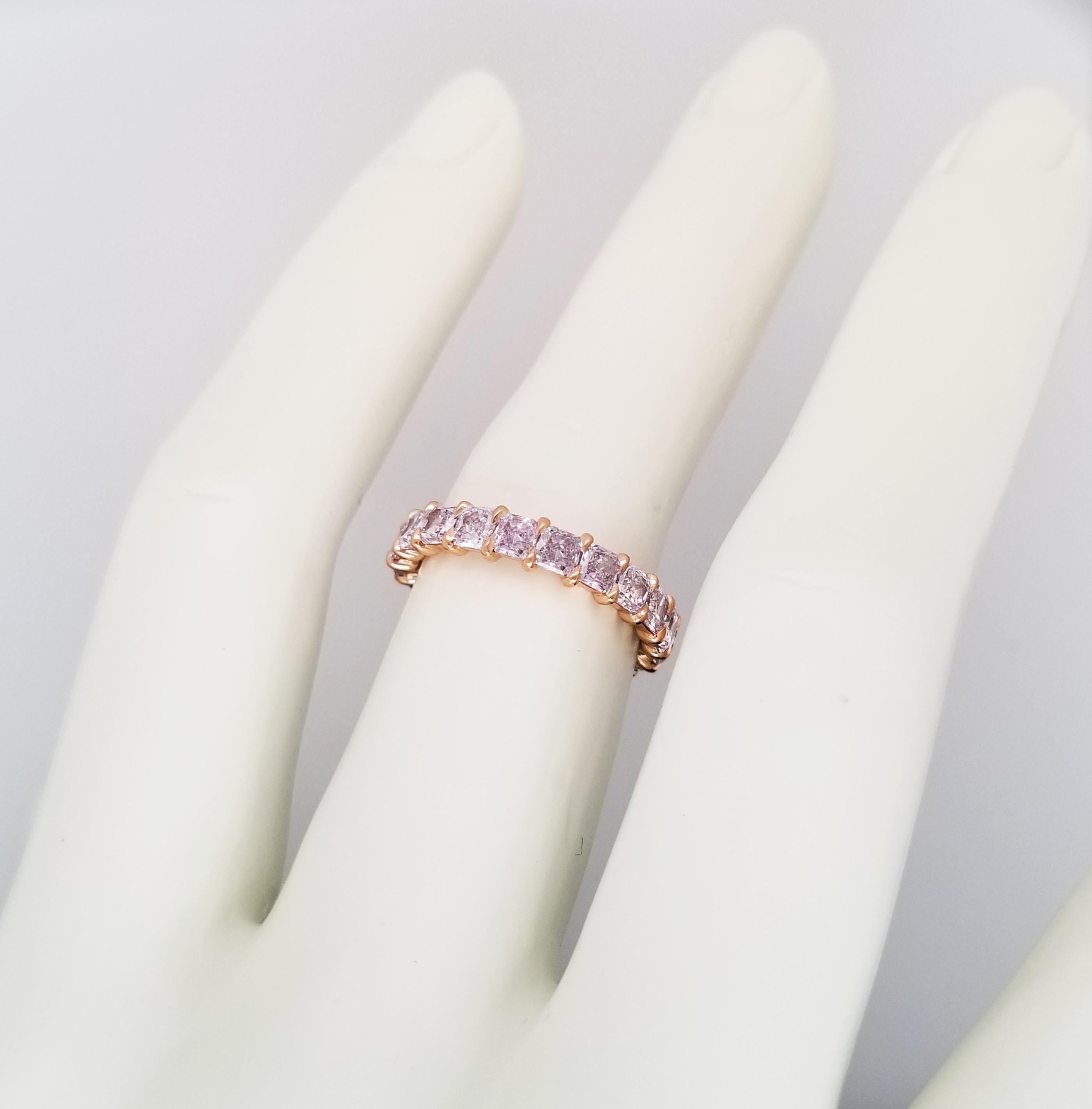 This fancy light pink radiant cut Eternity band is a pleasure to wear every day and contains 3.19 carats of natural fancy light pink diamonds set in 18 karats yellow gold handmade band. Each diamond total of 20 has a GIA color grading certificates,