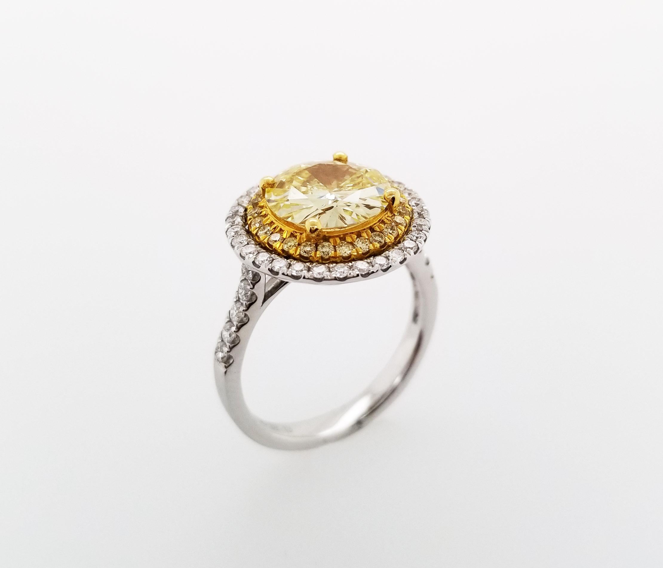 This Beautiful sunflower inspired design Ring From Scarselli features a 2-carat Fancy Yellow round brilliant Cut Diamond VS1 clarity with GIA certificate (see certificate picture for more detailed stone's information)  The center diamond is
