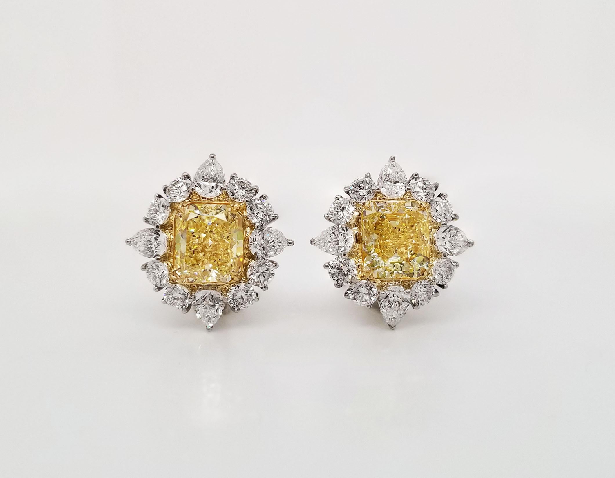 From the outstanding Scarselli's Intense Yellow diamonds collection, these matching radiant cut 3 carats each VVS/VS clarity GIA certified (see certificate pictures for detailed center stones' information), beautifully mounted on an 18 karat yellow