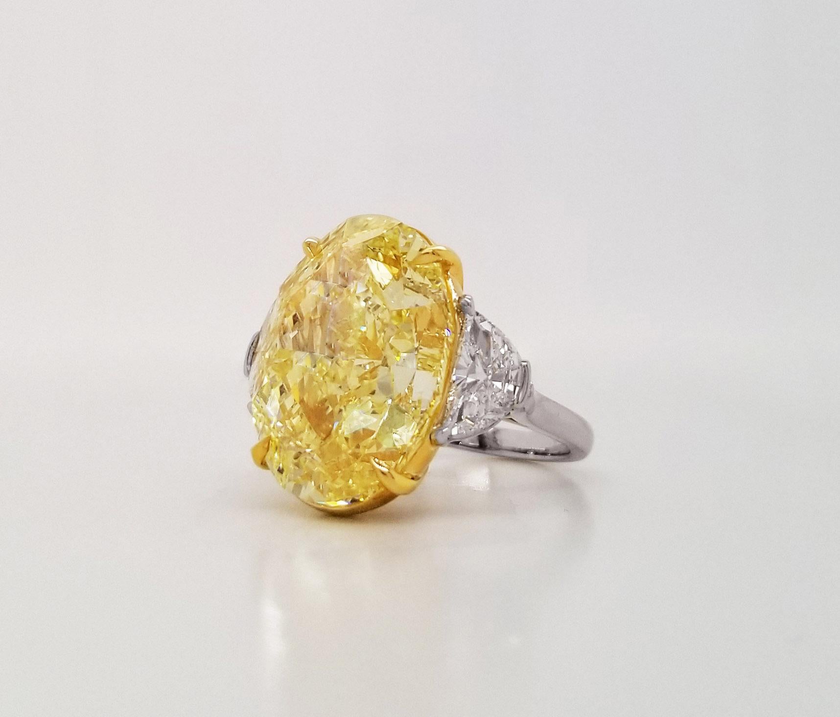 This outstanding 20 carat fancy intense yellow Oval Diamond is one of the latest color diamonds incorporated into the Scarselli collection, certified by GIA (see certificate picture for detailed stone information), and set in a hand-made 18k yellow