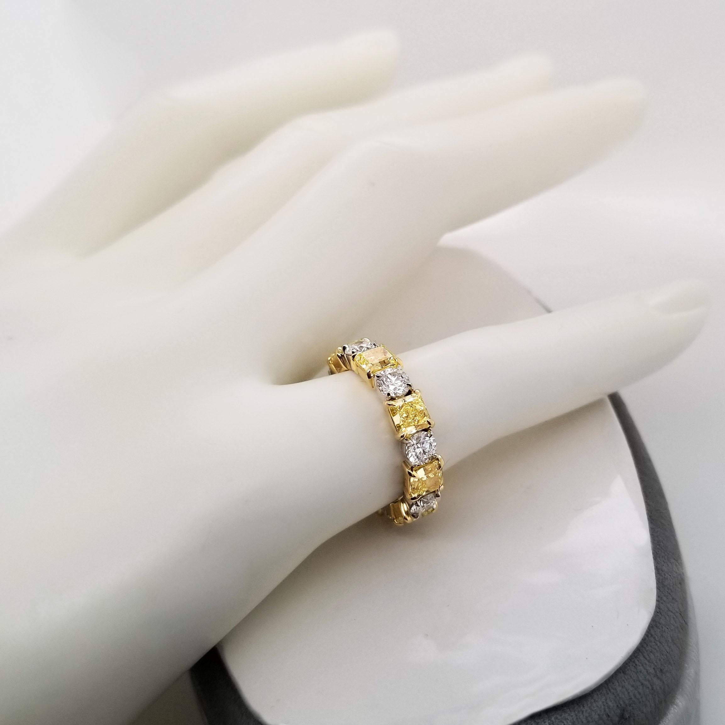 This Fancy duo color diamonds Eternity band is a pleasure to wear every day and contains 3.16 carats of natural fancy intense yellow diamonds in 8 stones GIA Certified (pictures of some of the certificates are available for detailed stone purpose)