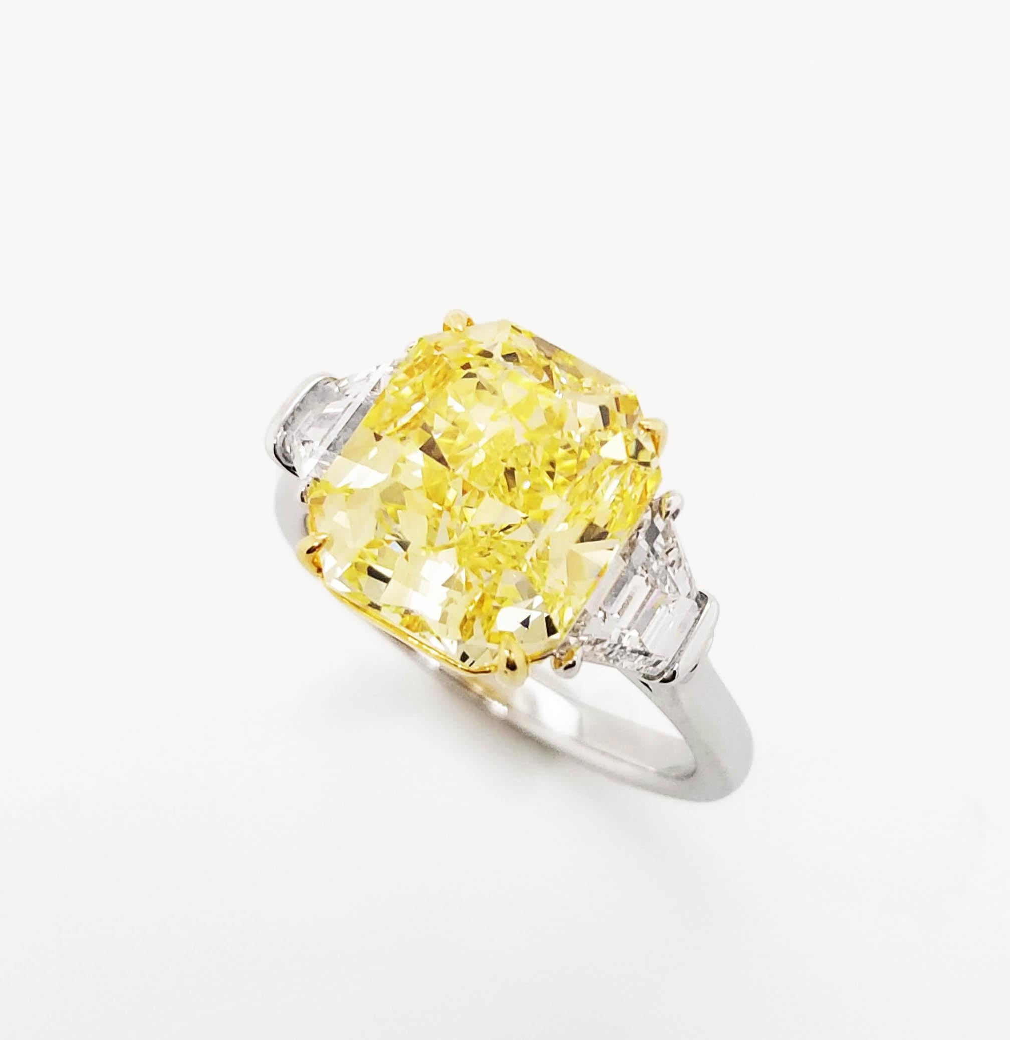 SCARSELLI is featuring a 5+ carat Fancy Intense Yellow Radiant Cut Diamond VS1 clarity, certified by GIA ( see certificate picture for detailed stone information) flanked by a pair of trapezoids VS diamonds totaling 0.92 carats set in handmade 18k
