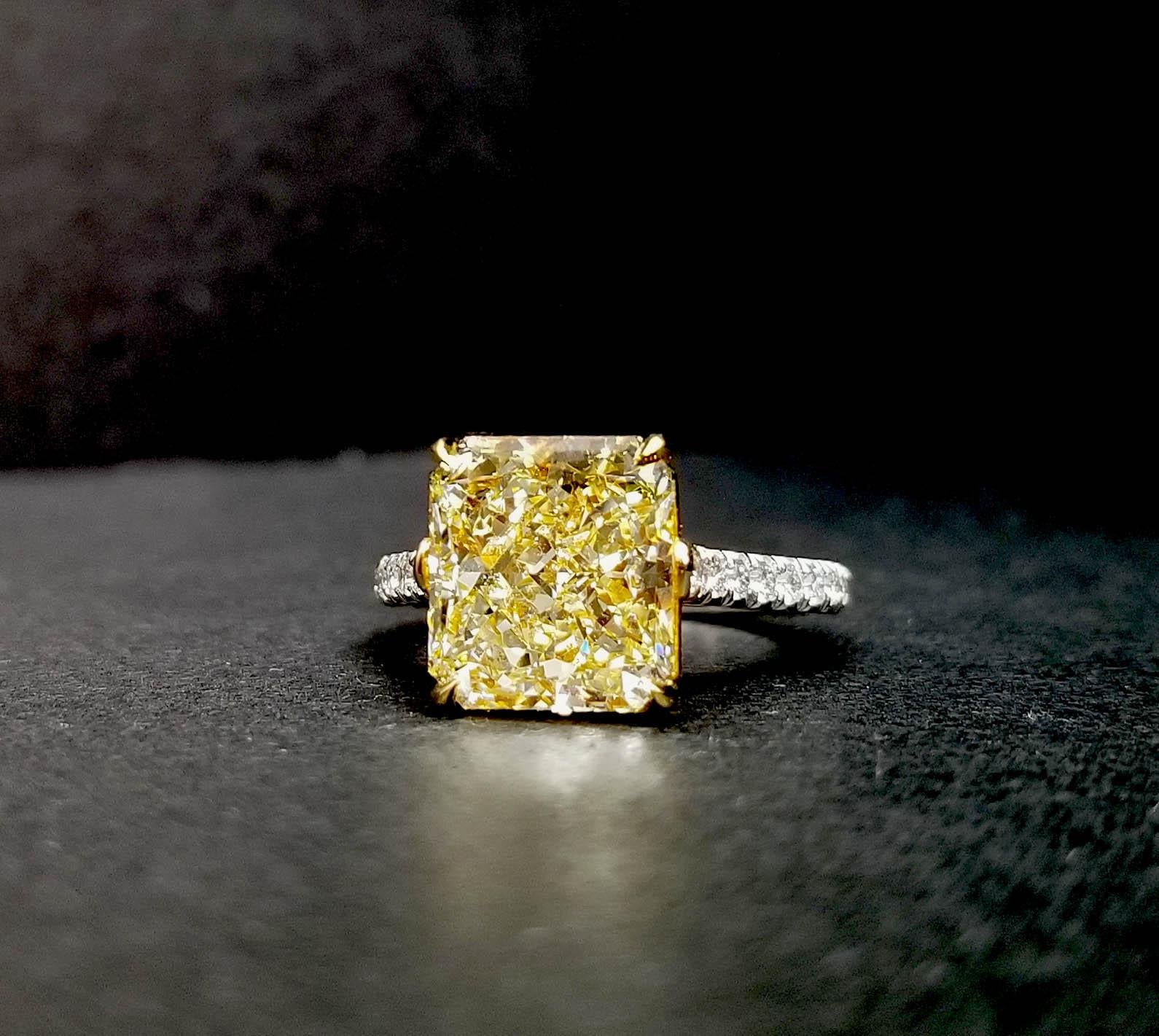 From SCARSELLI, this 5 carats fancy light yellow diamond VVS1  GIA certified (see attached certificate picture for detailed stone information) set in a mounting hand made with yellow 18k gold seat and prongs with a platinum shank. Along on the shank