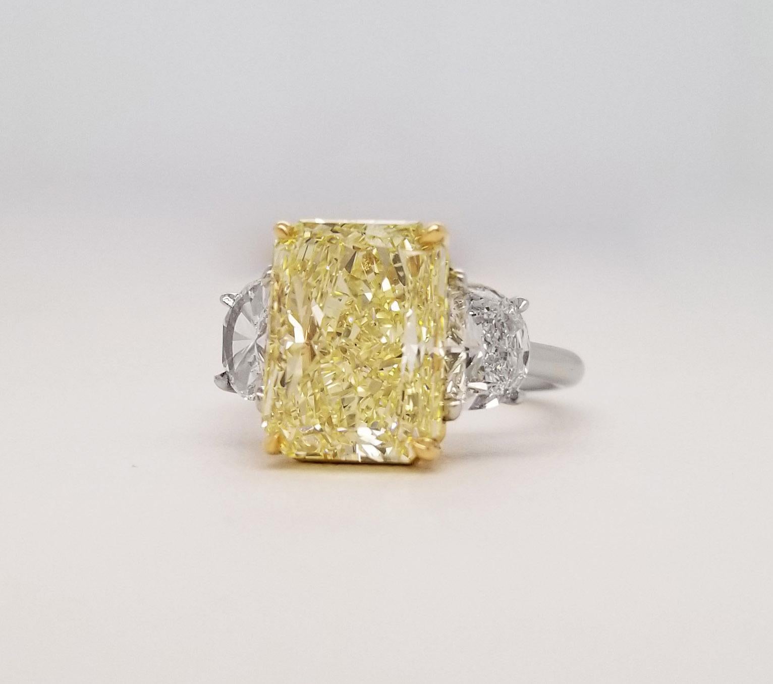 Scarselli features a 6+ carat Fancy Yellow radiant diamond  flanked by a pair of half moons 1.01 total carat weight for a modern and tailored look. The center stone is certified by GIA (see certificate attached picture for more detailed stone