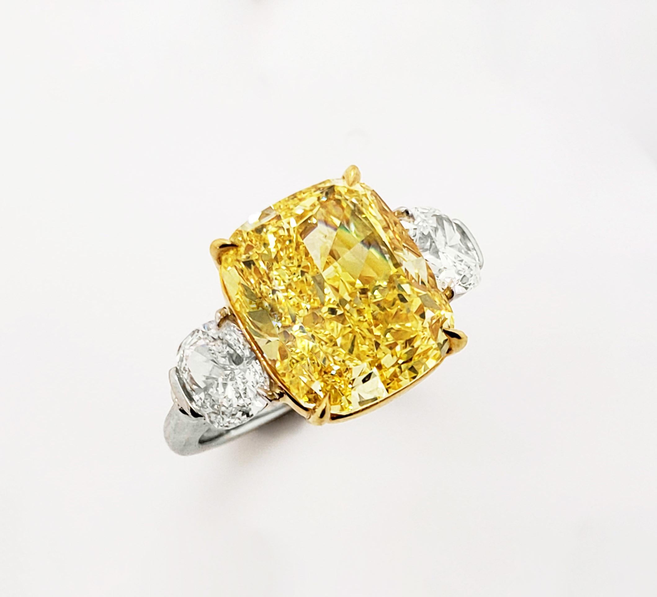 From SCARSELLI the world-renowned Natural Fancy Color diamonds, this 9+ carat Fancy Vivid Yellow cushion cut diamond (certificate picture attached for detailed center stone information) set in a hand-made 18k yellow gold and platinum ring, flanked