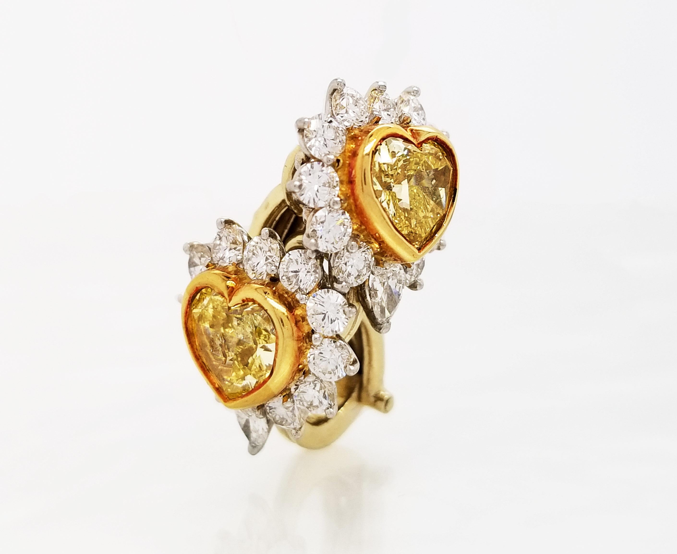 From the Couture Collection at Scarselli, these Fancy Yellow Heart shape Cut Diamonds 1.26 and 1.08 carats with GIA certificates 11011466 and 11011450 respectively (see certificates pictures for detailed stone information) The Yellow Diamonds are