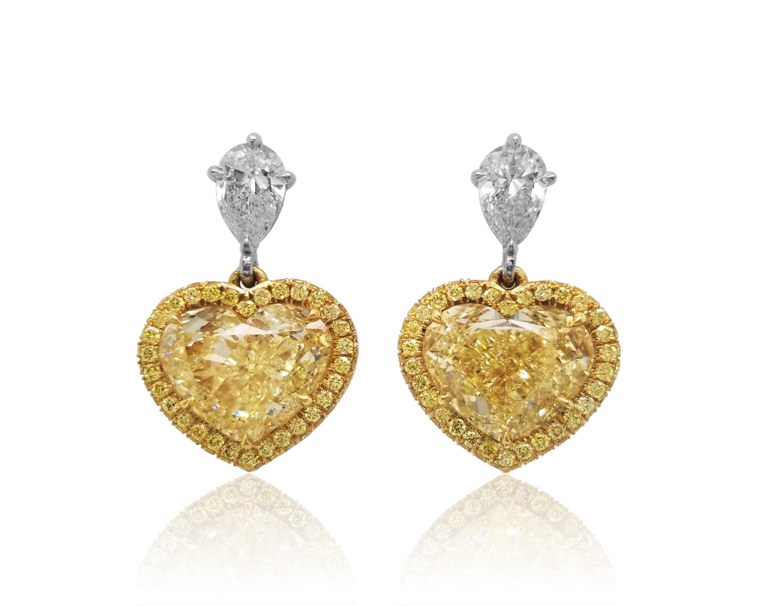 From the exclusive Collection at Scarselli, featuring 6+ carats fancy light yellow heart shaped Diamonds VS clarity with GIA certifications (see certificate pictures for detailed stones information). The Yellow Diamonds are beautifully set up in 18k