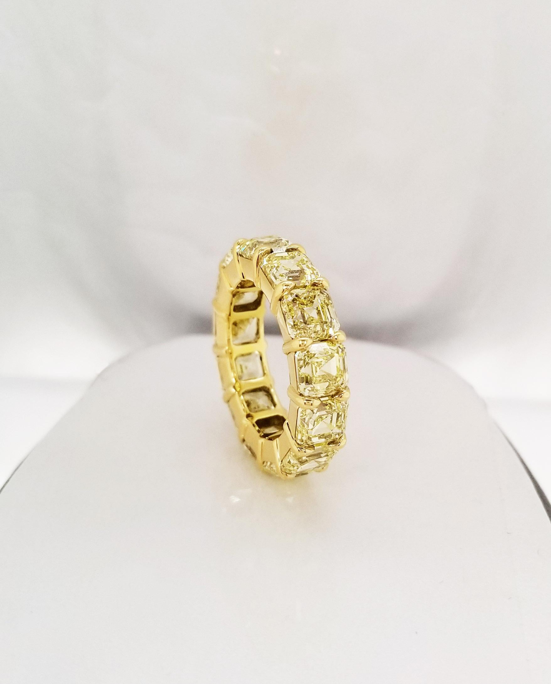 This fancy yellow Asscher Cut Eternity band is a pleasure to wear every day and contains 13.33 carats of natural fancy yellow diamonds of VVS - VS clarity in 18 karat yellow gold. Each diamond has a GIA grading certificate (13 stones certified).