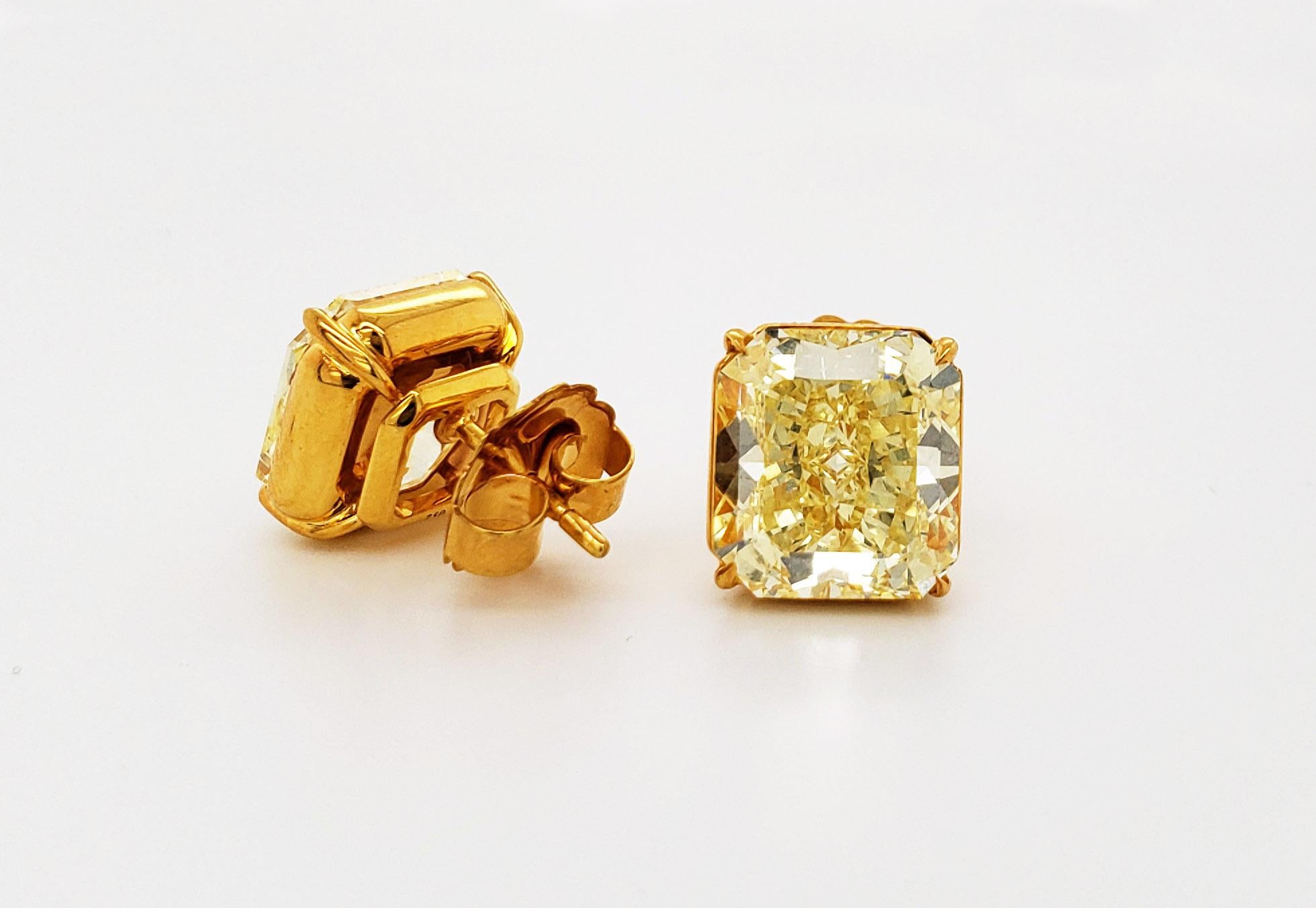 From the Couture Collection at Scarselli, these Fancy Intense Yellow Radiant Cut Diamonds are 7.05 carats and 7.59 carats VS2-VS1 clarity. The Yellow Diamonds are simpleness beautiful set up in an 18 karat yellow gold. Earpin earrings included the