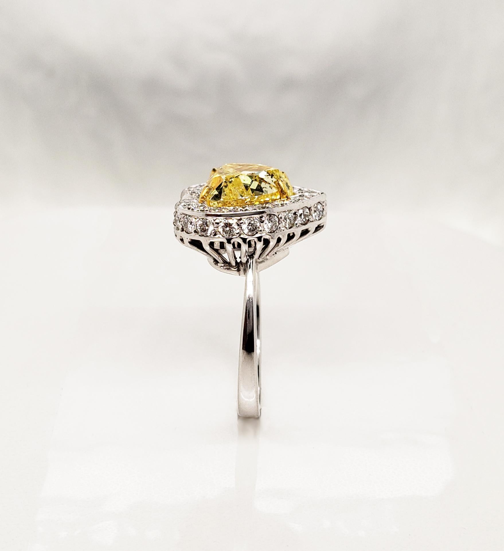 Scarselli GIA 5 carat Intense Yellow Heart Shape Diamond Ring in Platinum In New Condition For Sale In New York, NY