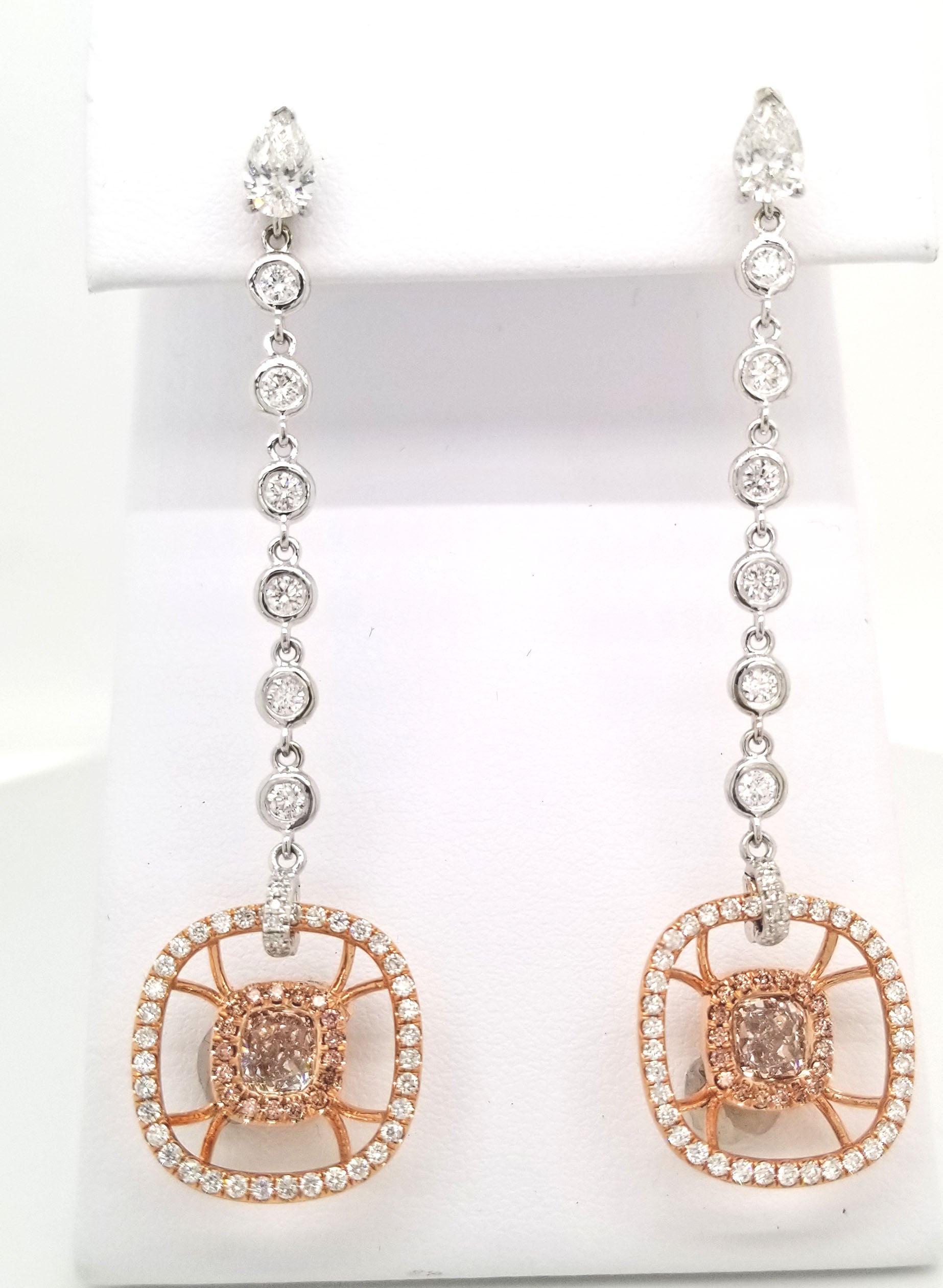 Pair of adjustable, 18K Rose Gold Dangle Earrings with 1.49 carats of GIA Certified Light Pink Diamonds. Rounded square basket and upper dangle encrusted with over 140 rhombus, round brilliant and melee cut white diamonds, total carat weight 4.66.