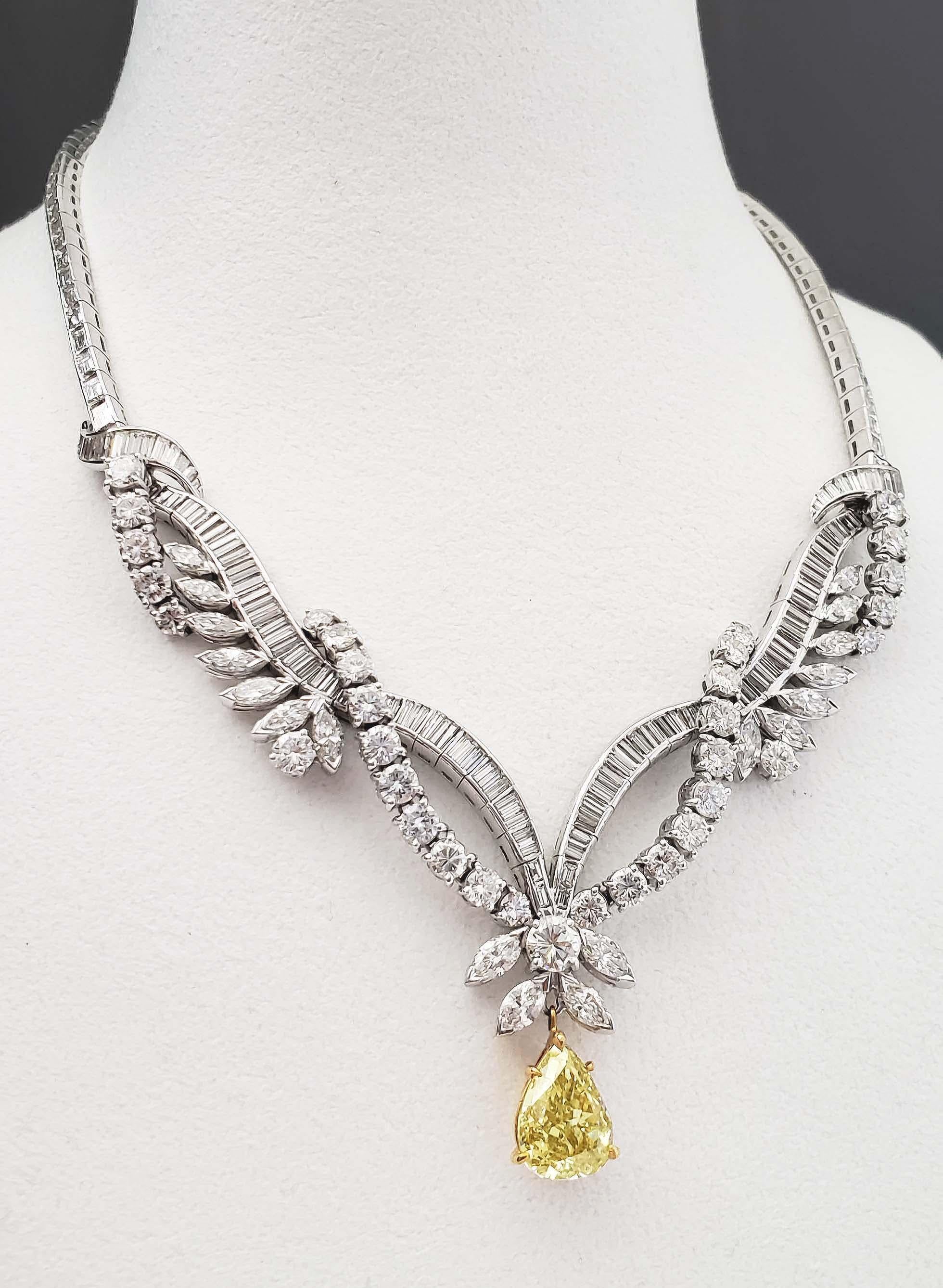 From Scarselli, recognized leaders in the world of natural fancy color diamonds, this enchanting infinity 18k-Platinum necklace with a fancy brownish yellow pear shape 4.15 carat diamond as center stone held by 24 carats of round, baguette and