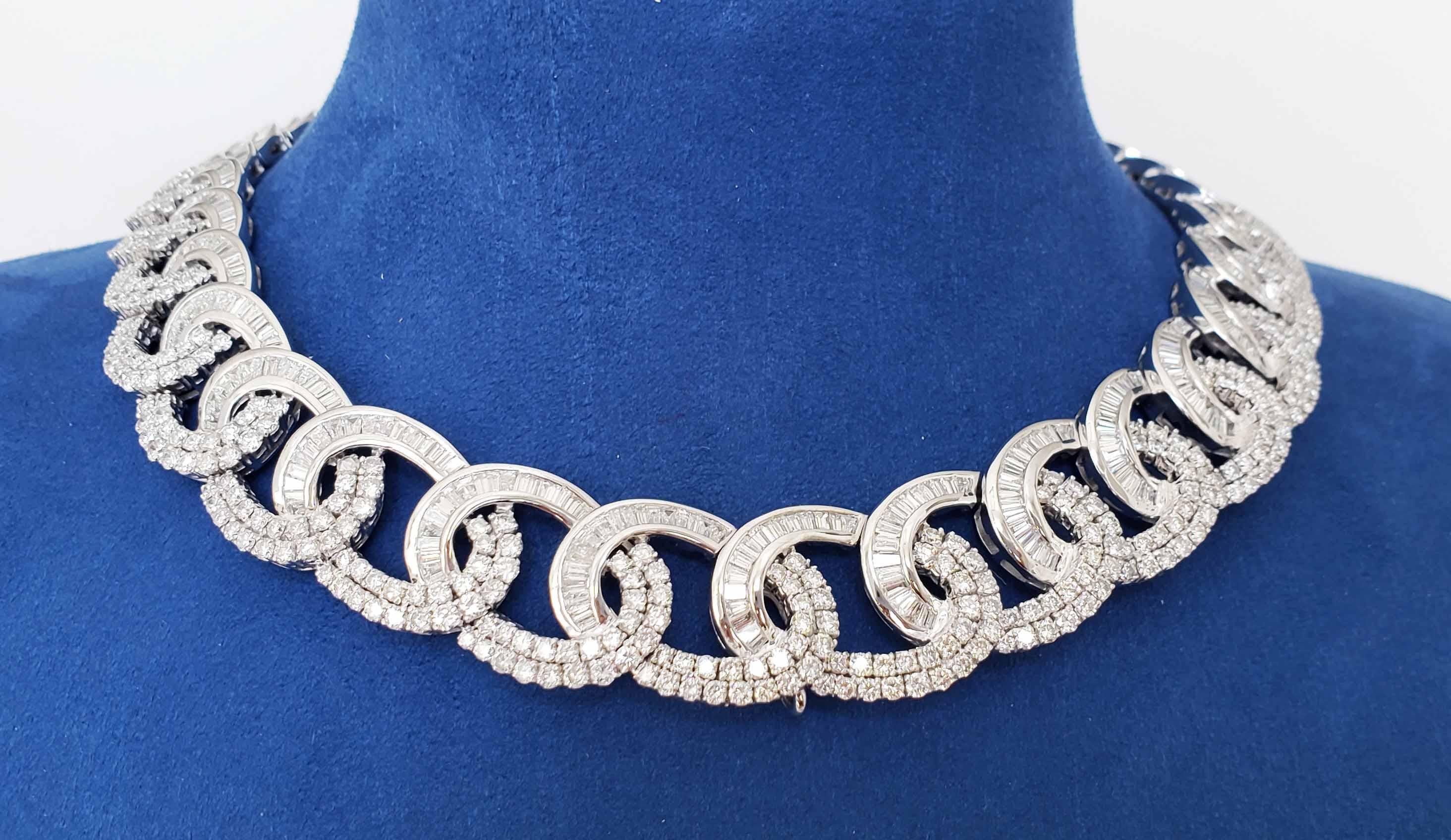 The ultimate wearable luxury, this linkage necklace in 18 karats white gold with 54.50 carats in white diamonds. The loops are enhanced with deeper baguette and emerald cut diamonds to percept the continues movement in this spectacular Cuban chocker