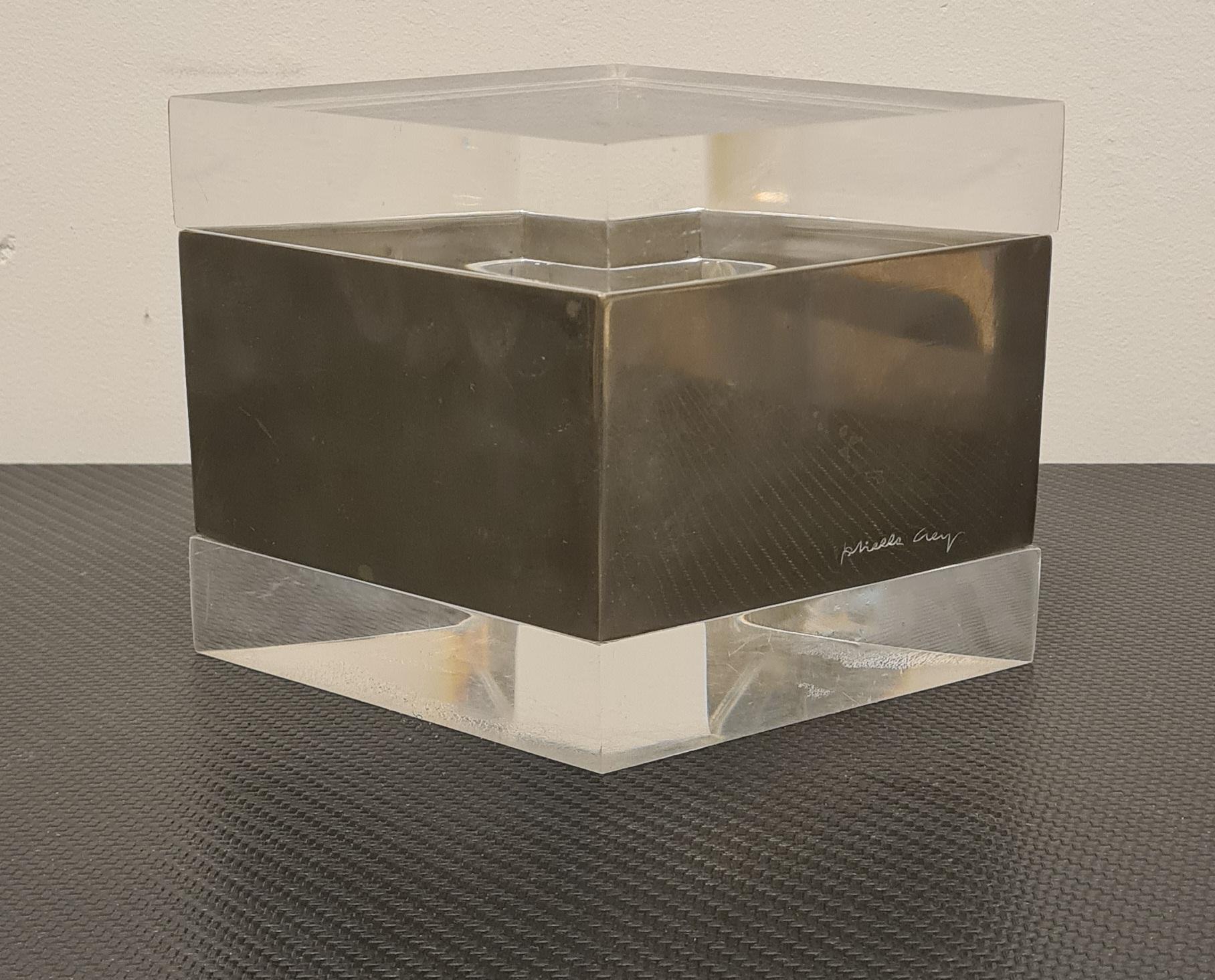 Box with lid by Designer Gabriella Crespi.

Rare and essential rhomboid-shaped box made of lucite and silver-plated metal.

Lucite is a variety of polymethylmethacrylate, commonly plexiglass or perspex this material was invented in the late 1920s as