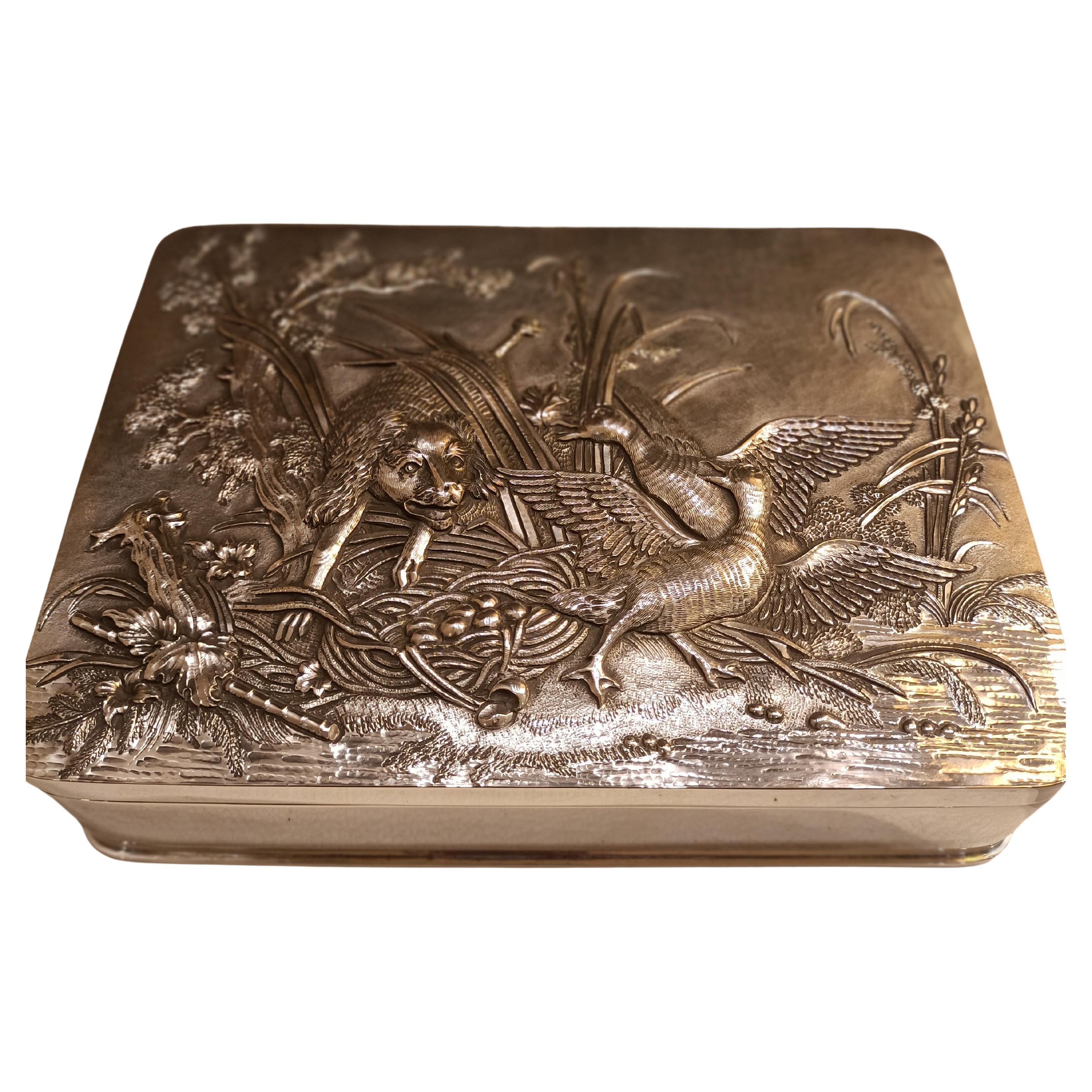 Silver box with hand-chiseled decorations For Sale