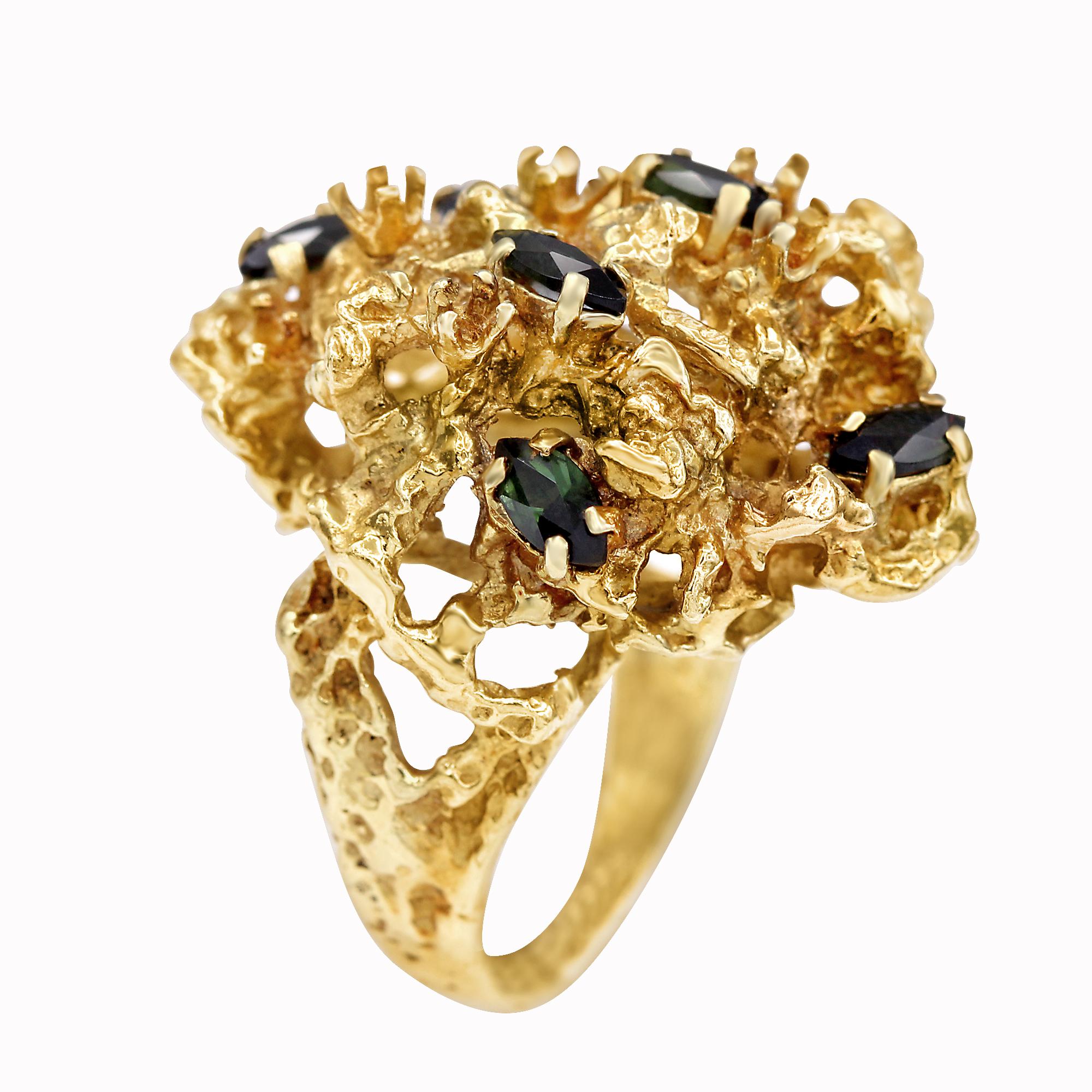 A large and bold 18K Yellow Gold Cluster Ring, set with seven scattered Marquise-Cut Green Tourmalines. Ring Size US 7. Cluster Length: 1 1/8