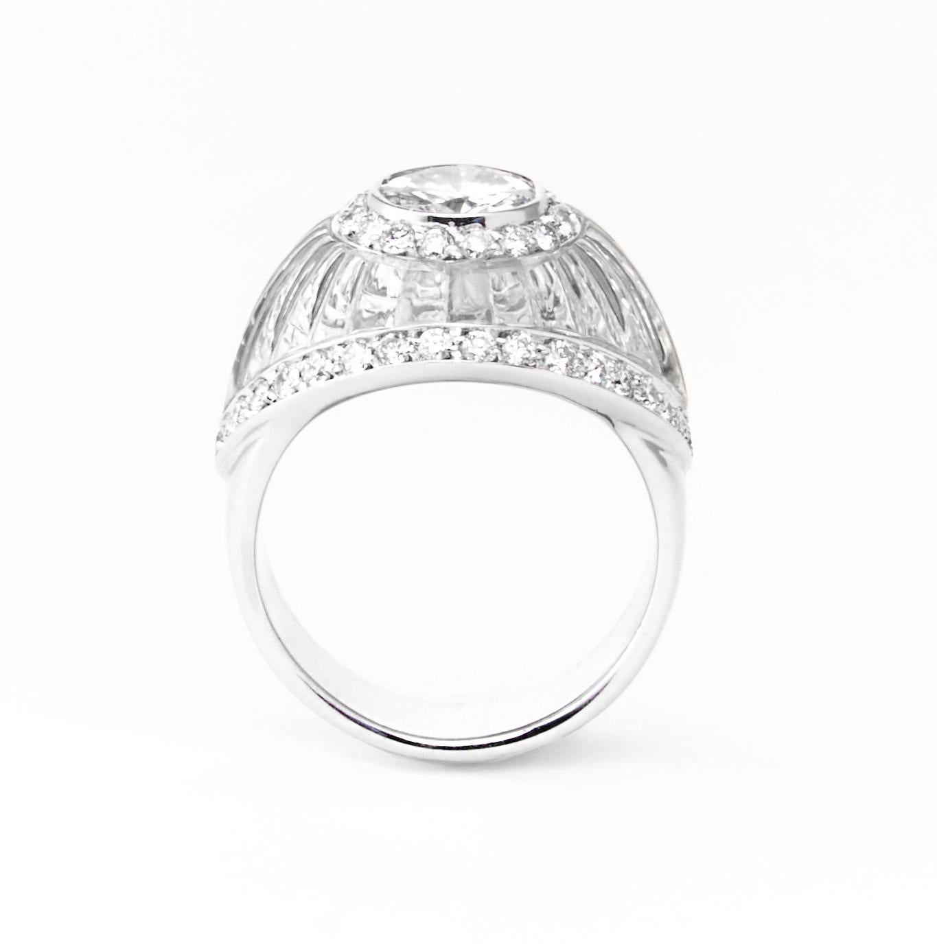 Elevate your sense of luxury with this Italian-crafted ring by the esteemed jeweler Fulvio Maria Scavia. A focal point of this exquisite piece is a dazzling white round brilliant cut diamond, artfully set in white gold and surrounded by a delicate