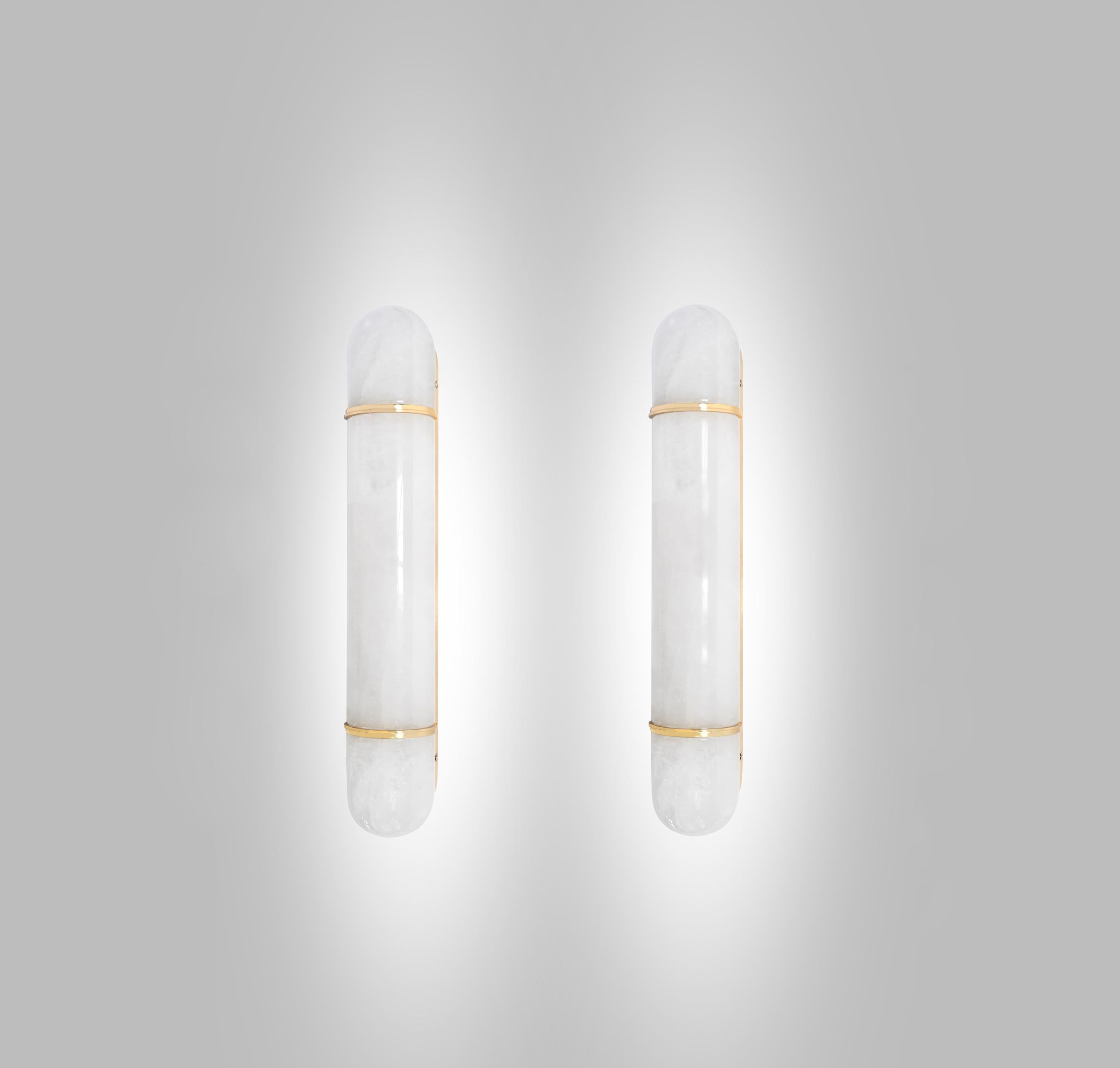 Pair of finely carved rock crystal sconces with the aged brass decoration. Created by Phoenix Gallery, NYC.
Each sconce installs four sockets. Use candelabra lights. 60watts each LED bulb, 240w total.