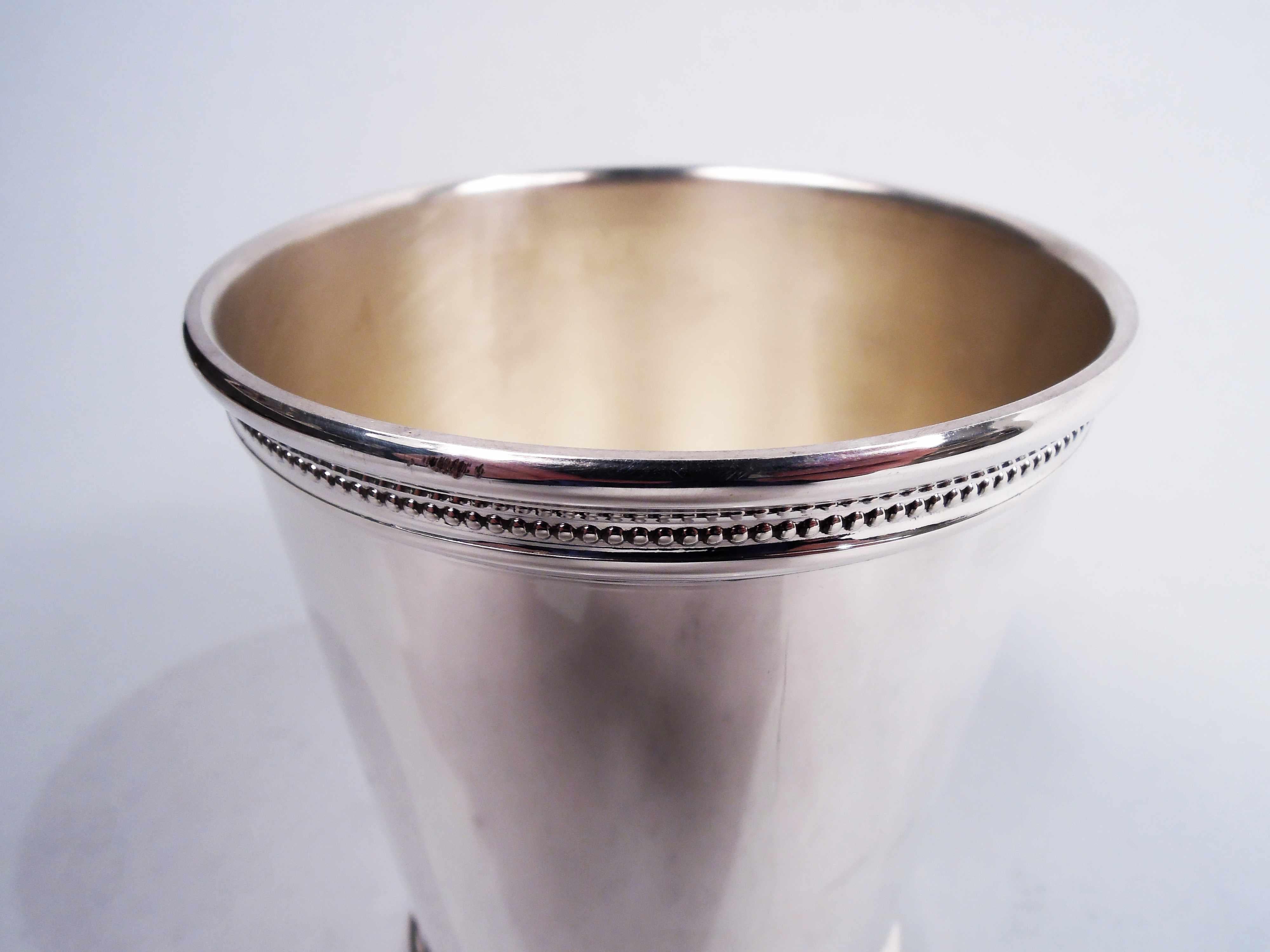 Dubya-era sterling silver mint julep. Made by Scearce in Shelbyville, Kentucky. Straight and tapering sides, and beaded and molded rim and foot. A great barware cup from the surprisingly long ago aughts. Marks include maker's stamp and presidential