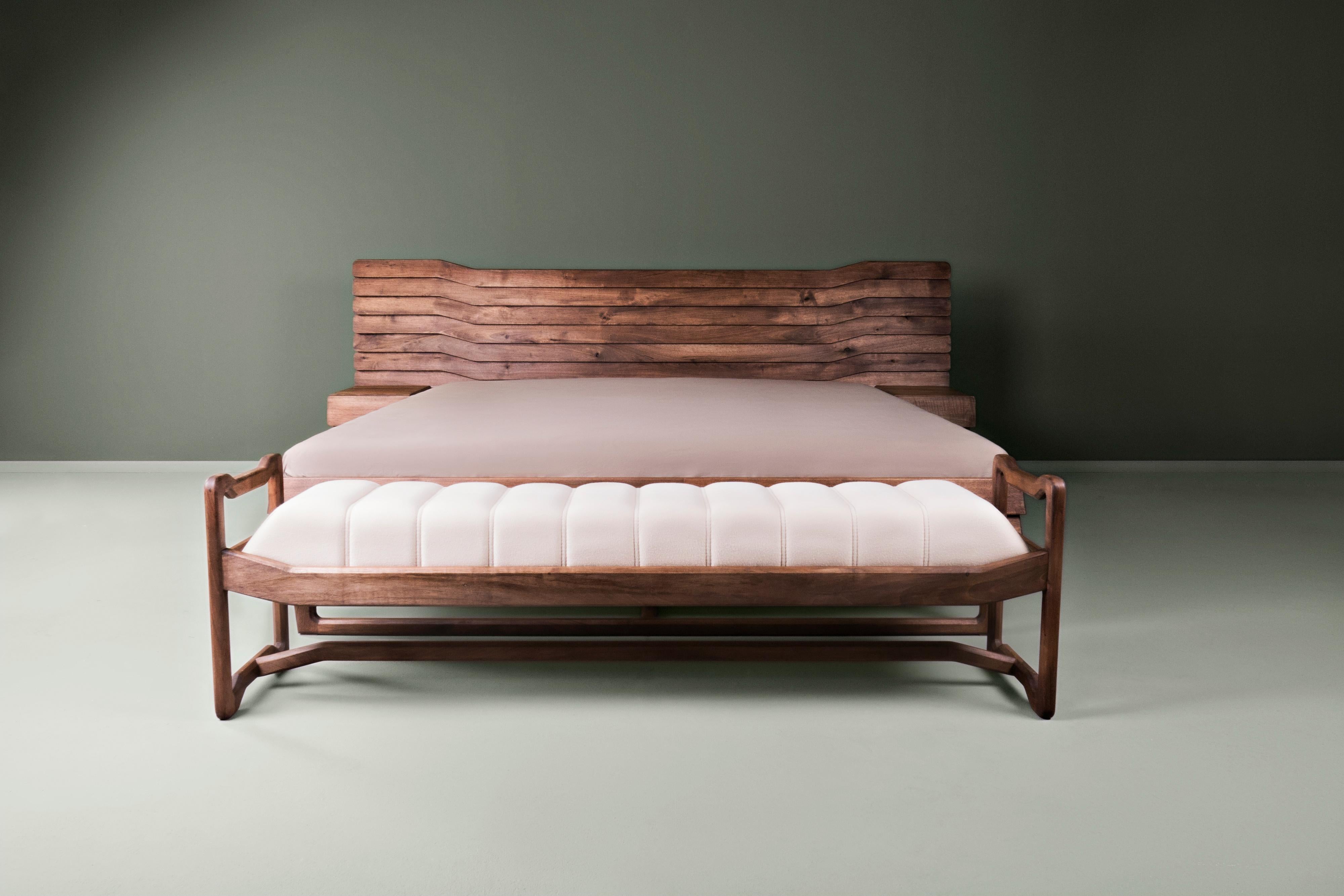 This bench was created as an addition to the bed Wave. The primary purpose was to be set up in front of or near the bed Wave and to be a support element for changing clothes. In addition, it can be combined as a bench with dining tables in