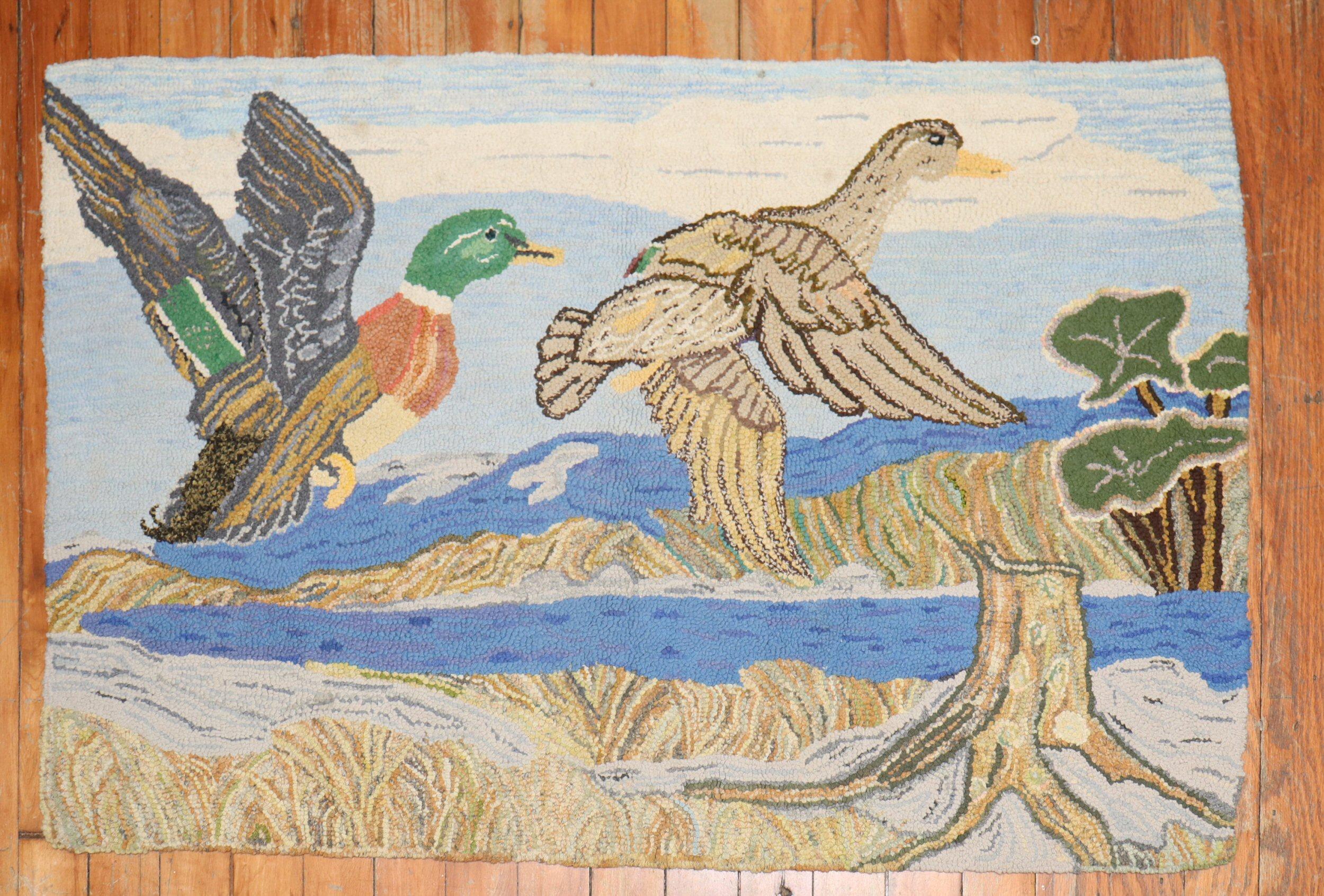 A handmade decorative American hooked rug from the middle of the 20th century depicting 2 ducks on a lively scenic view. The condition is really nice. No stains, no tears, has been professionally cleaned.

Measures: 24'' x 37''.