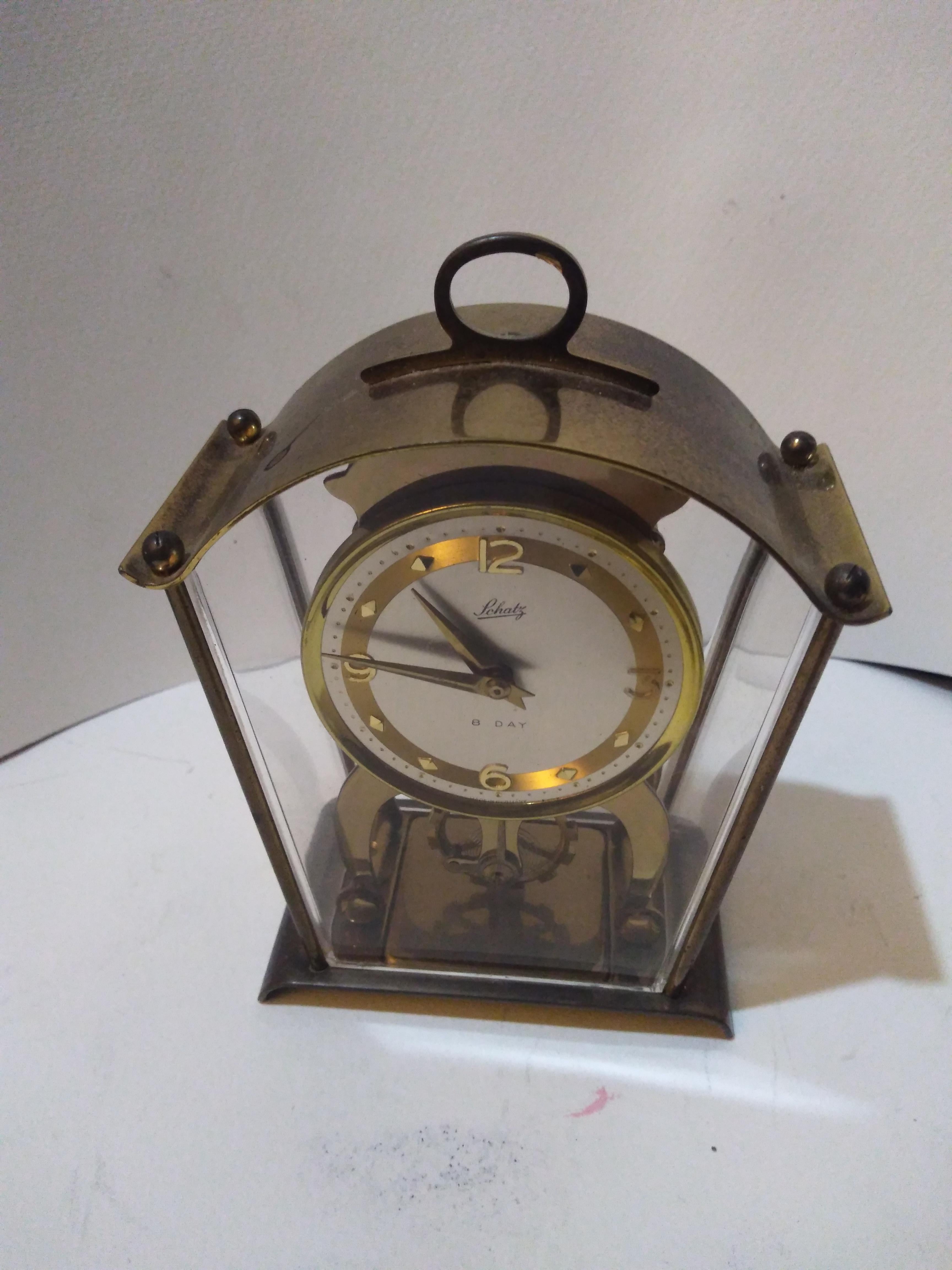 This is a 59 Schatz and Schone Mantle Clock. 
It's a wind up 8 day clock.