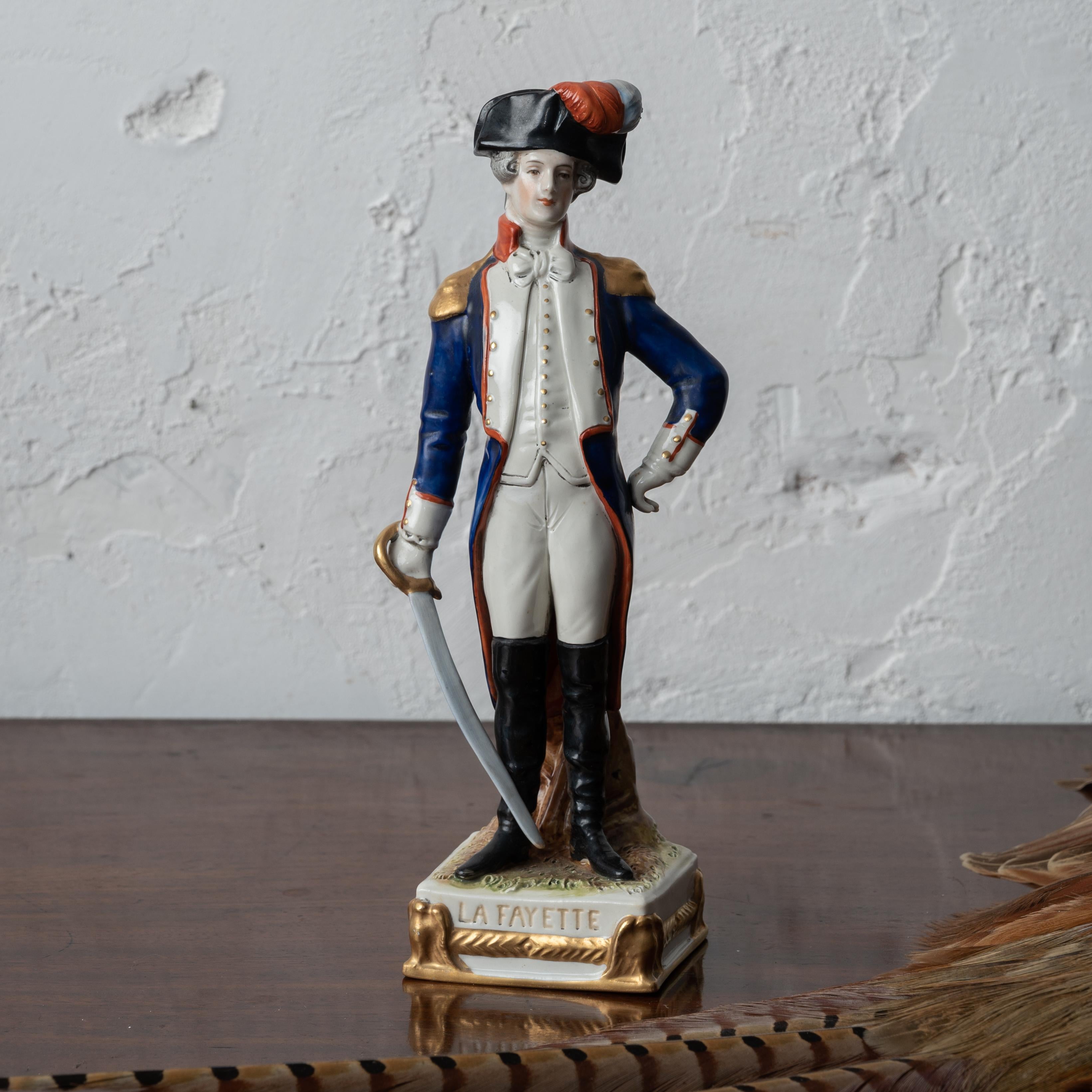 A Scheibe-Alsbach LaFayette porcelain figurine, 20th century.

3 ½ inches wide by 2 ½ inches deep by 9 ½ inches tall

