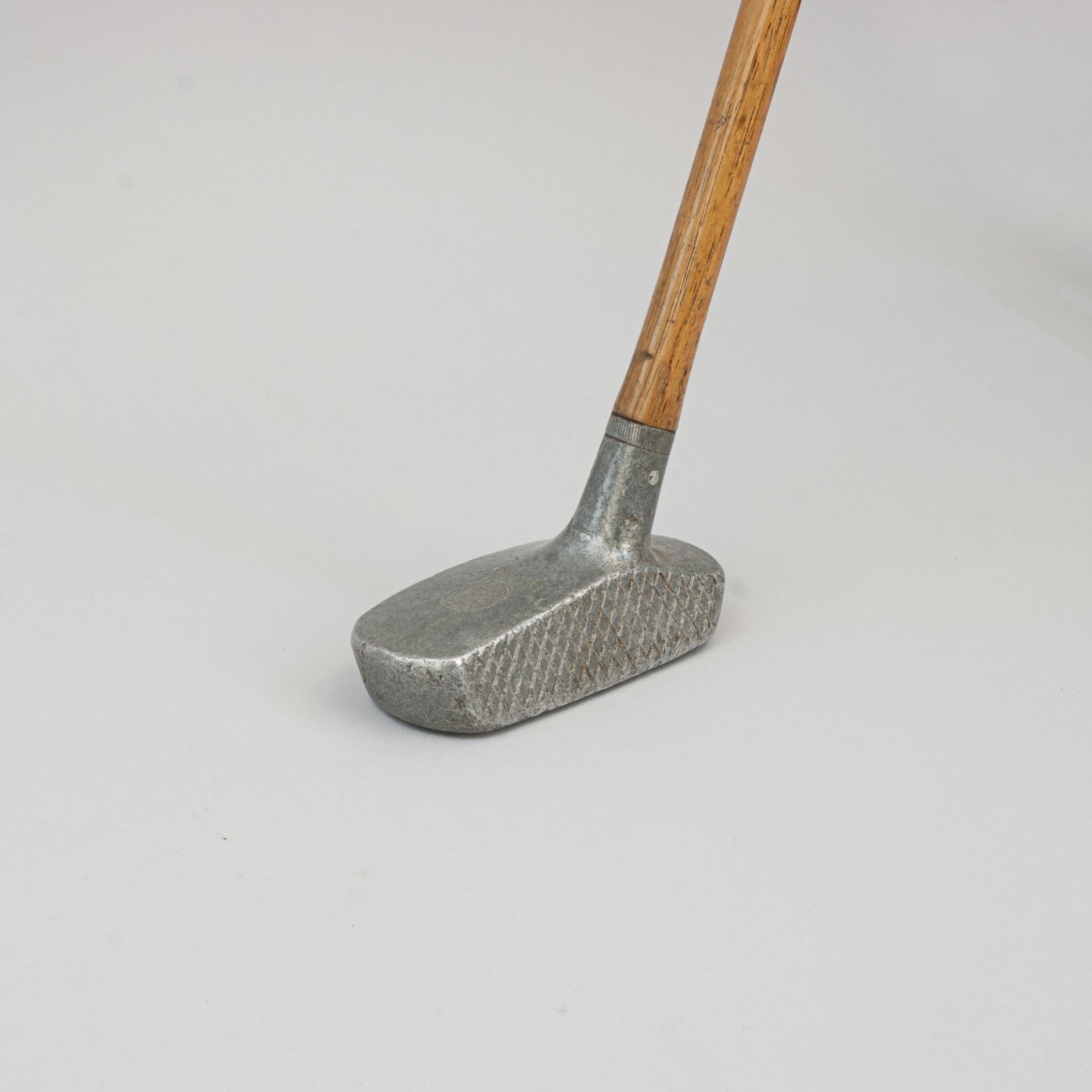 Aluminium Center Shafted Schenectady Putter.
A good example of an aluminium Schenectady putter by Spalding. The club head with diamond face markings, the crown is stamped 'A.G. Spalding & Bros., Made In Gt. Britain' in a circle with the Spalding