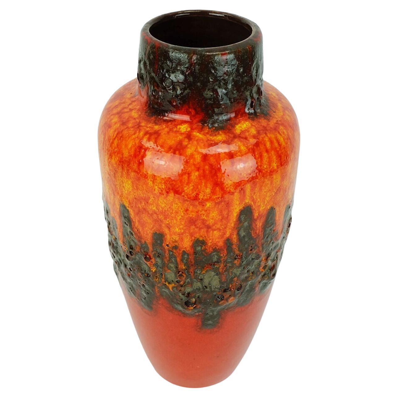 1960s 70s West German vase manufactured by Scheurich Keramik. Model number 517-30 with intense red, orange and yellow glaze combined with black fat lava glaze in zigzag pattern. 

Dimensions in cm:
Height 31 cm, width 14 cm.

Dimensions in