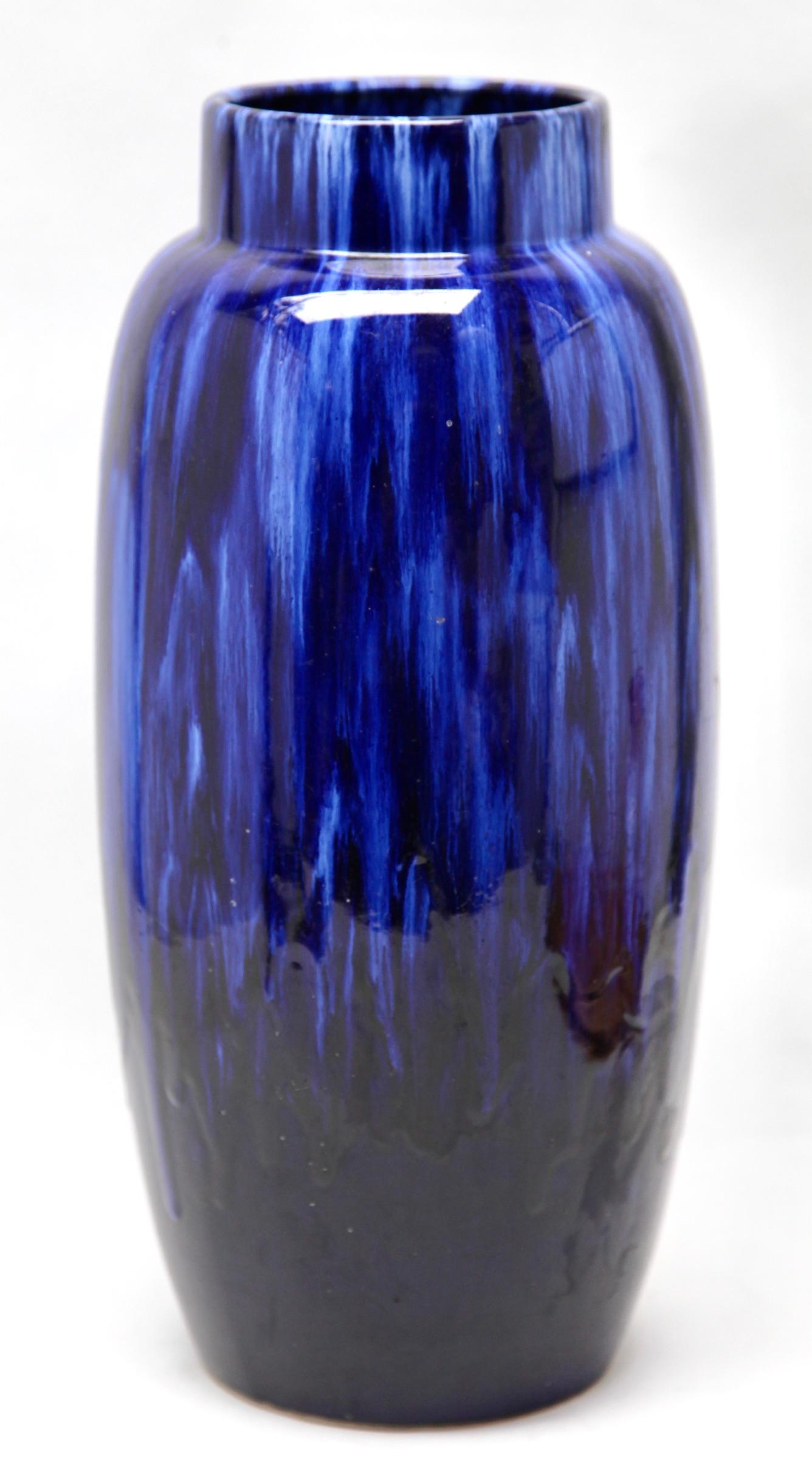 Vintage Scheurich vase in blue or black drip glaze featuring the indented
On close inspection the glaze includes flecks black and sea-blue which give greater depth to the surfaces.

Please don't hesitate to get in touch with any further